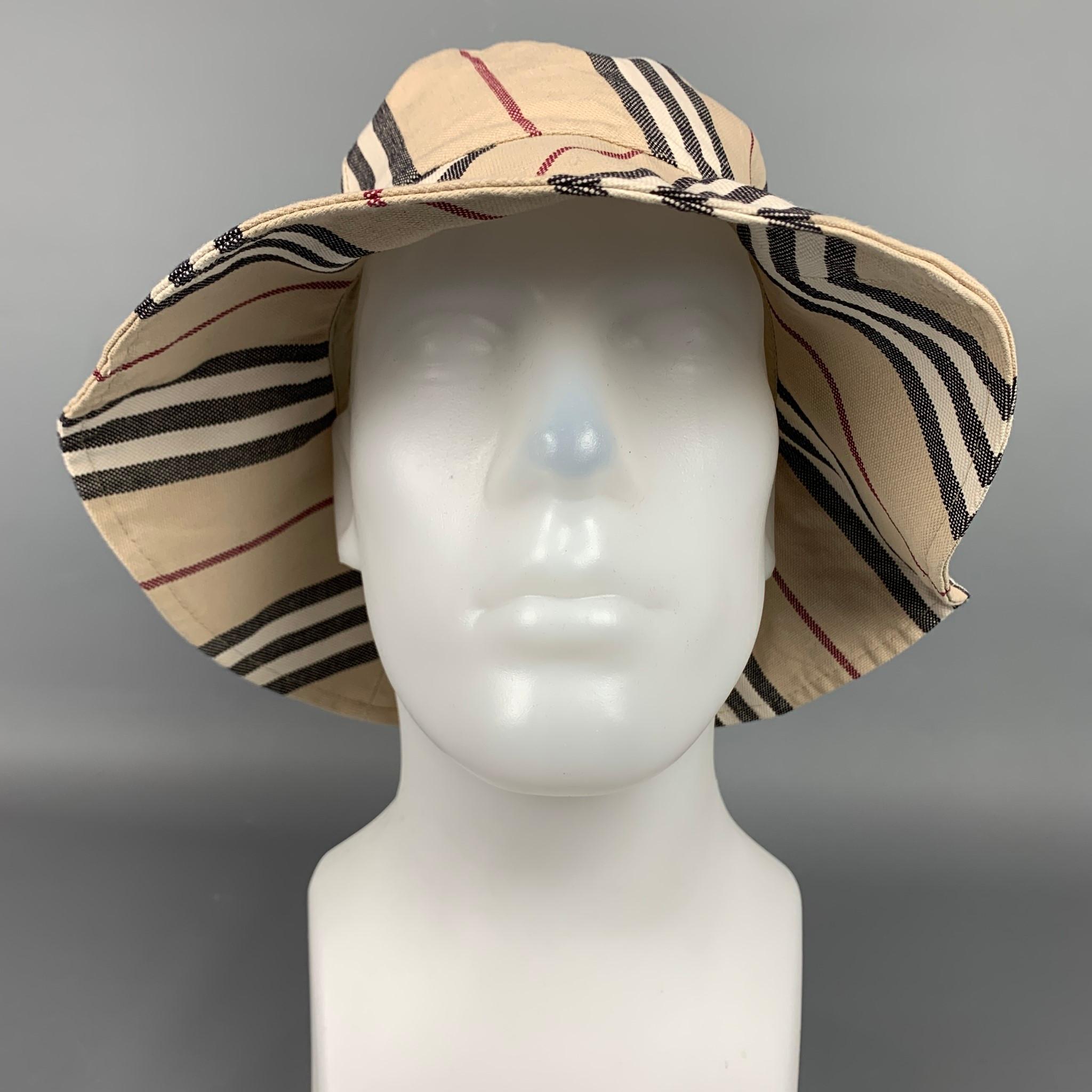 BURBERRY LONDON hat comes in a beige plaid cotton canvas featuring a bucket style and a wide brim.

Good Pre-Owned Condition.
Marked: Size tag removed.
Original Retail Price: $390.00

Measurements:

Opening: 17 in.
Brim: 3.5 in.
Height: 4 in. 