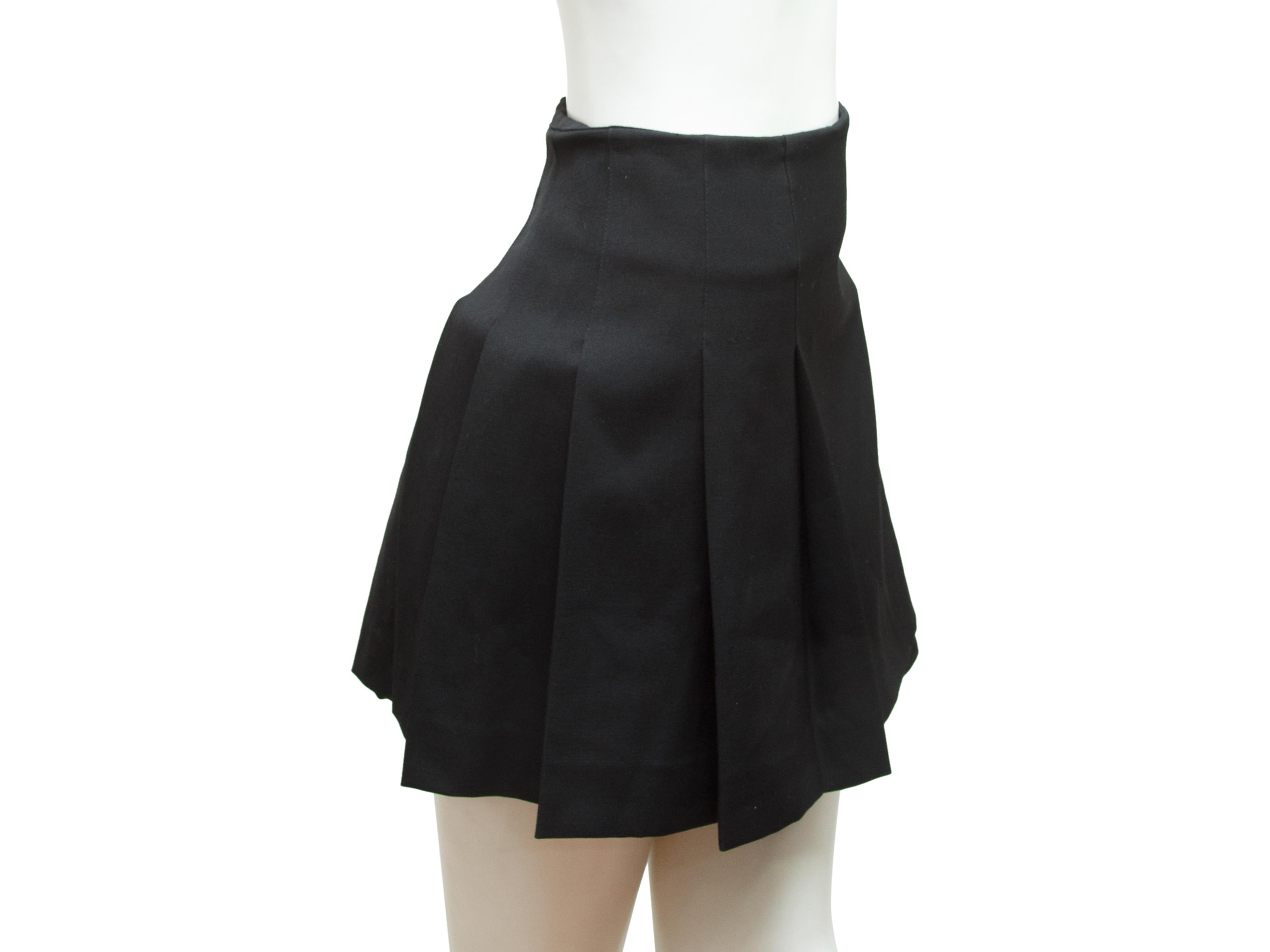 Product details:  Black kilt skirt by Burberry London.  Side double buckle closure.  Pleated back.  Frayed trim.  30