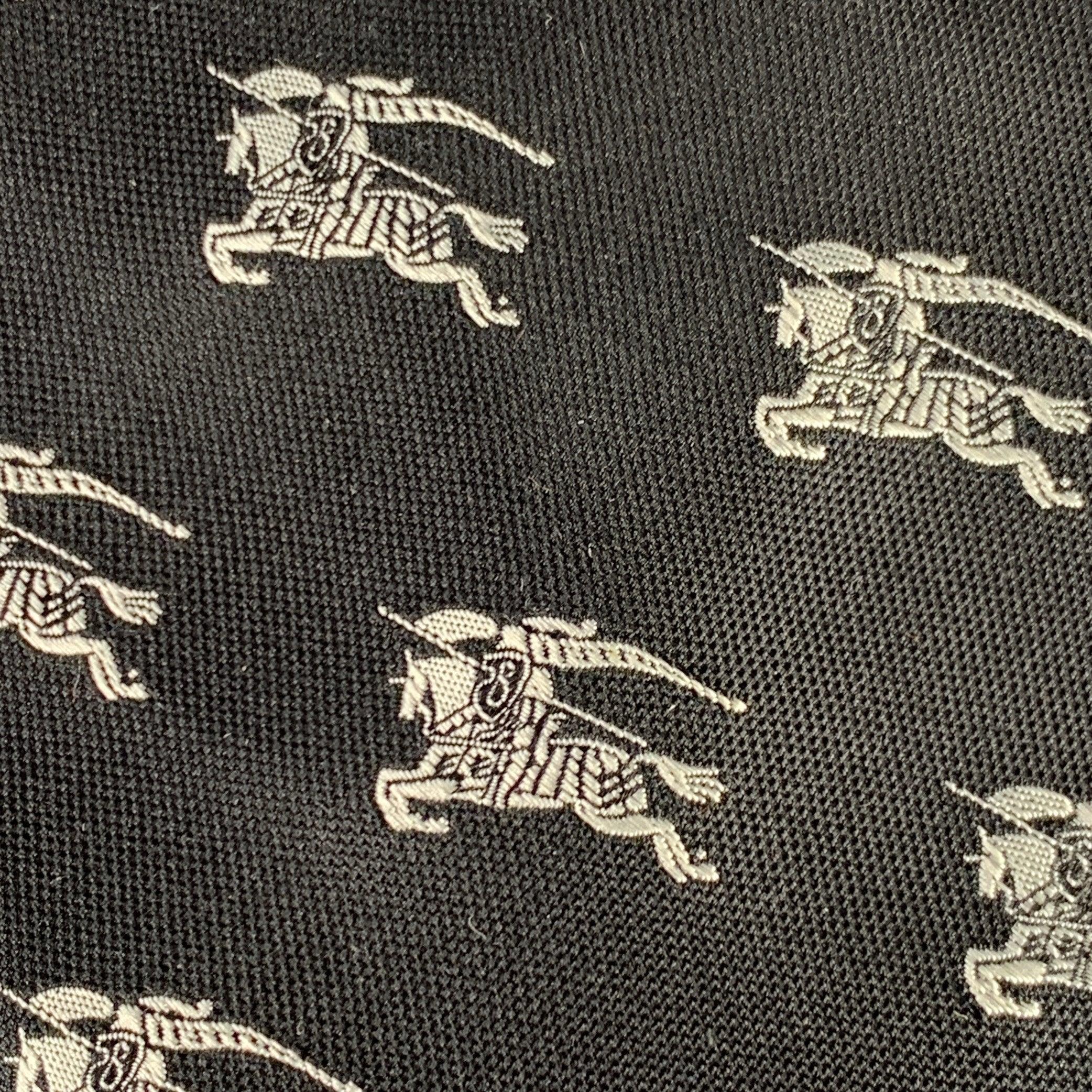 BURBERRY LONDON necktie
in a black silk featuring white horse logo stitched pattern. Made in Italy.Excellent Pre-Owned Condition. 

Measurements: 
  Width: 3.75 inches Length: 59 inches 
  
  
 
Sui Generis Reference: 135628
Category: Tie
More