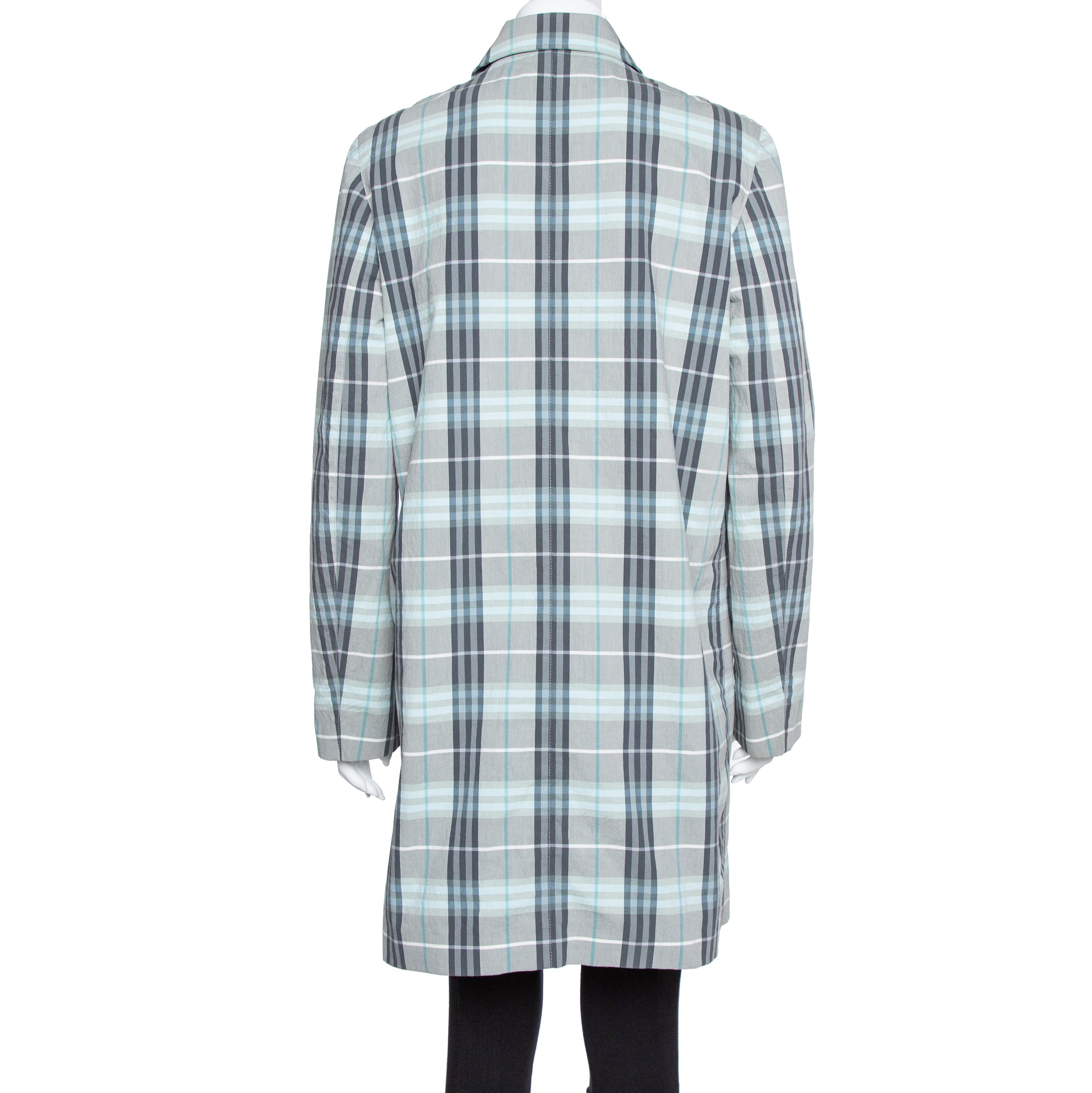 Burberry's coats are a dream addition to any woman's closet. This blue creation from Burberry London was crafted from quality materials and it not only carries a well-tailored silhouette but also stylish details like the Nova Check pattern all over,