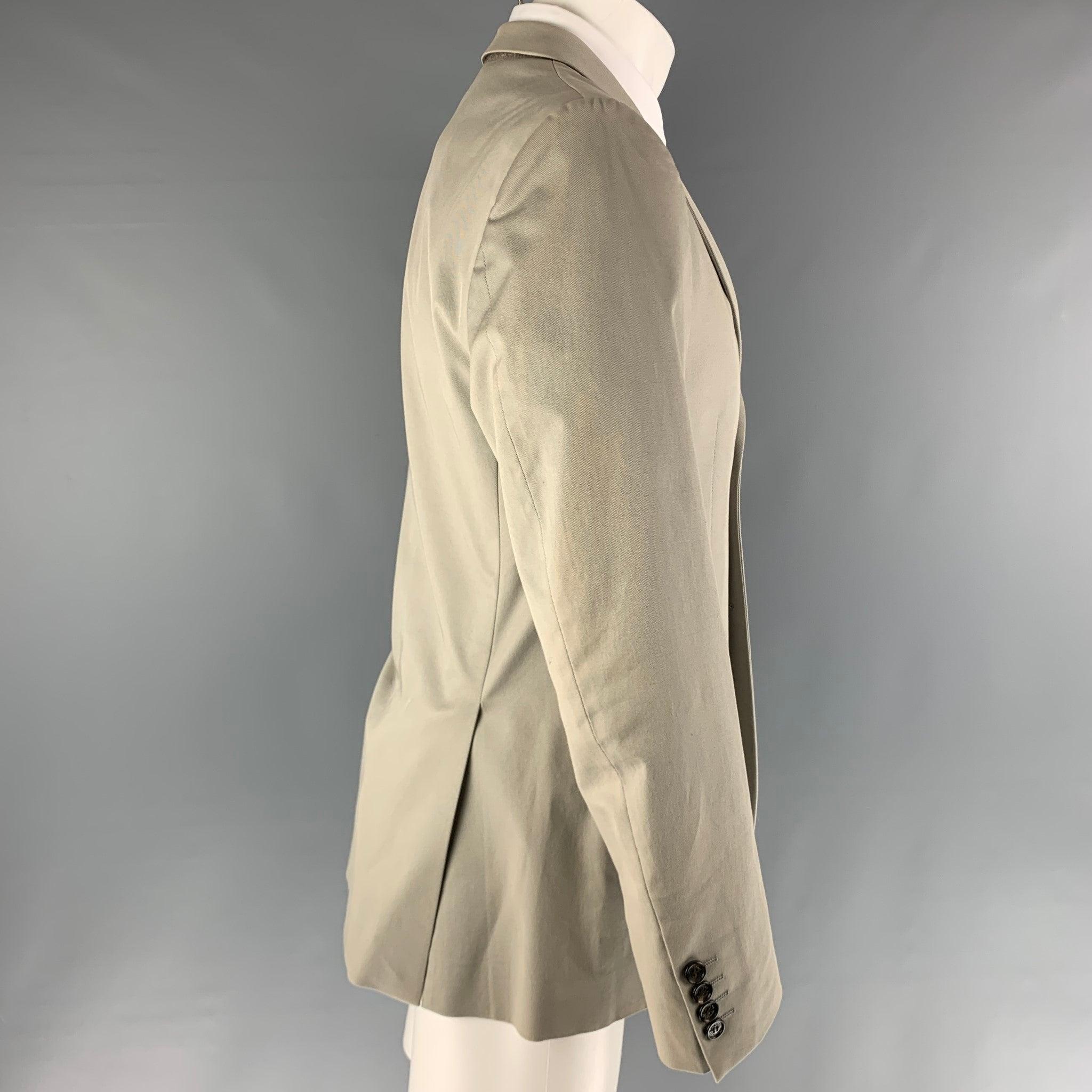 BURBERRY LONDON grey sport coat comes in a grey cotton & elastane blend featuring a single breasted cut and flap pockets, and notch lapel. Made in Portugal.Excellent Pre-Owned Condition. 

Marked:   50 

Measurements: 
 
Shoulder: 18 inches Chest:
