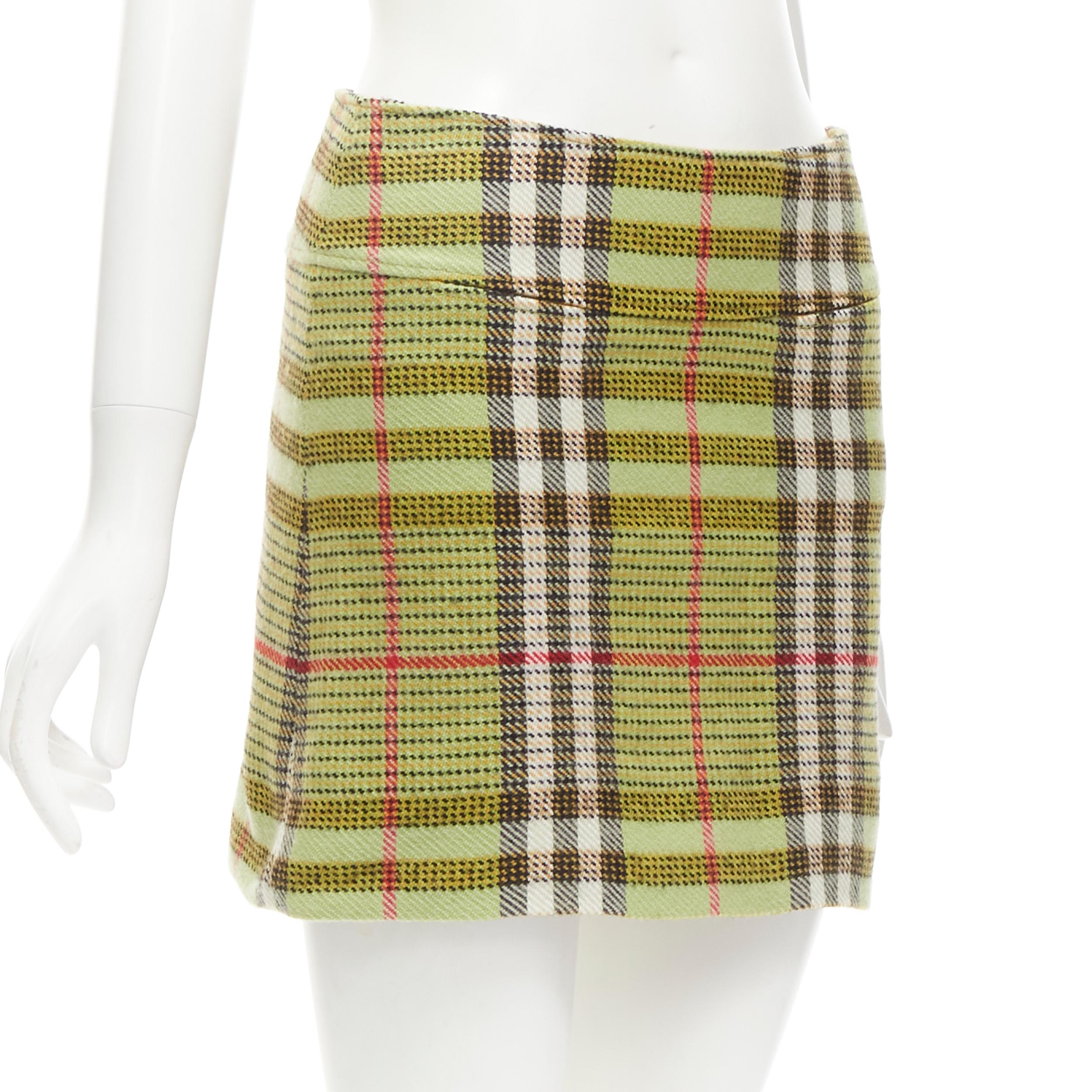 BURBERRY LONDON House Check green wool mini skirt UK6 US4 XS
Brand: Burberry

CONDITION:
Condition: Excellent, this item was pre-owned and is in excellent condition. Composition label removed.

SIZING:
Designer Size: UK 6 / US4

MEASUREMENTS:
Waist: