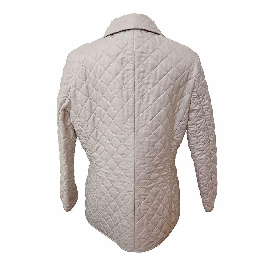 Polyester Beige color Quilted Two pockets Button closure Length shoulder / hem cm 68 (26,77 inches) Shoulders cm 42 (16,53 inches)
