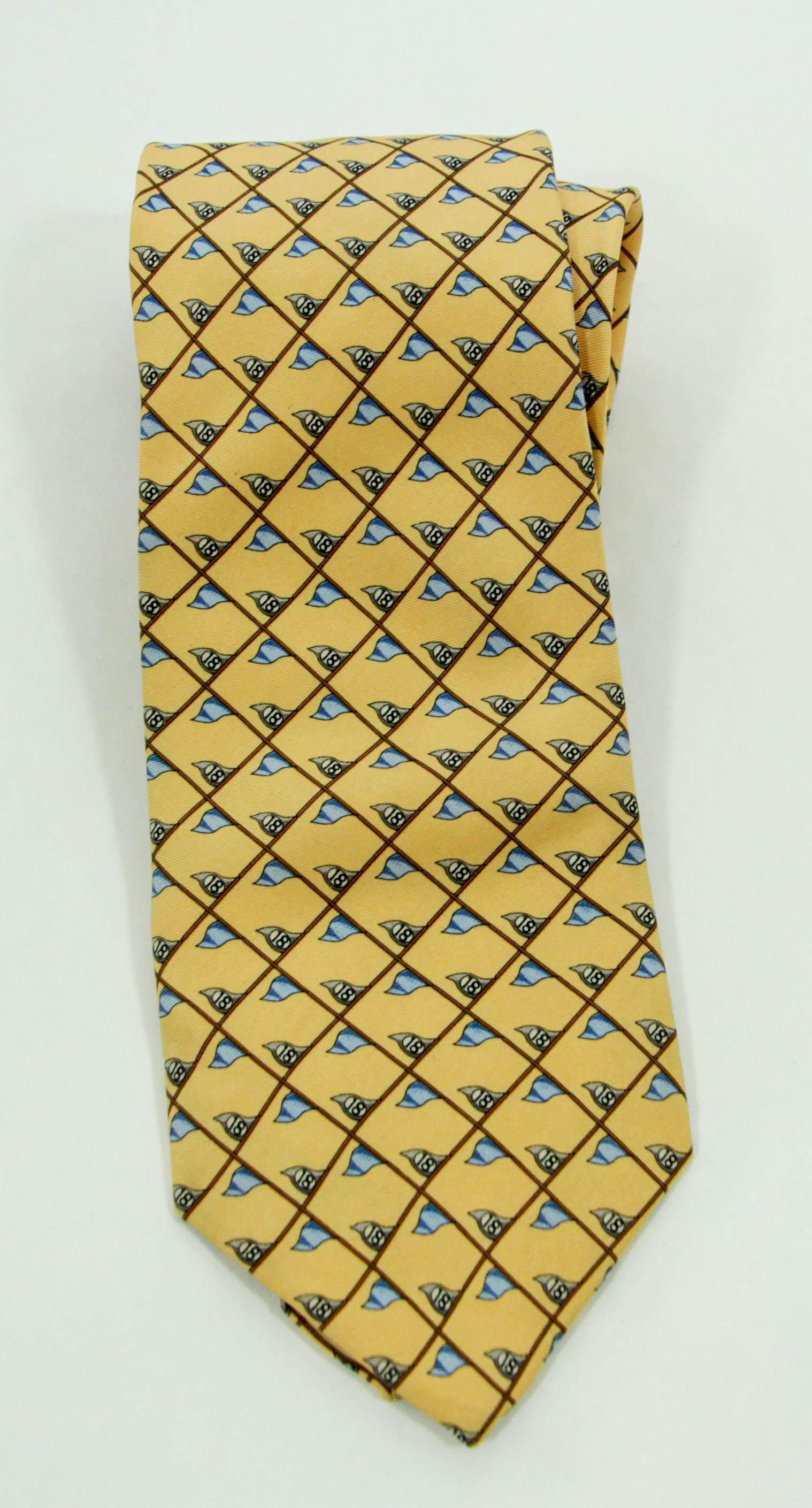 Burberry London Limited Edition Silk Tie.
Luxury Work Print Silk Tie.
100% silk necktie from Burberry London, Limited Edition Silk Tie; Luxury Work Tie. In like new condition featuring a light yellow background with designs.
Made in France.
Good