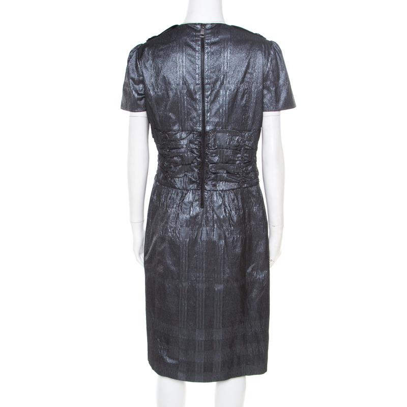 You cannot go wrong with a stunning dress like this Burberry London piece. Tailored beautifully and detailed with ruched touches, this metallic silver dress will be perfect with pumps or slingback sandals and a shoulder bag.

