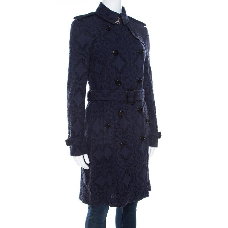Treasure this marvelous trench coat from Burberry to counter a sumptuous look. Crafted with a cotton and nylon blend, it features adorable lave detailing and a double breasted style to count on. This coat is accentuated with classic collars, long