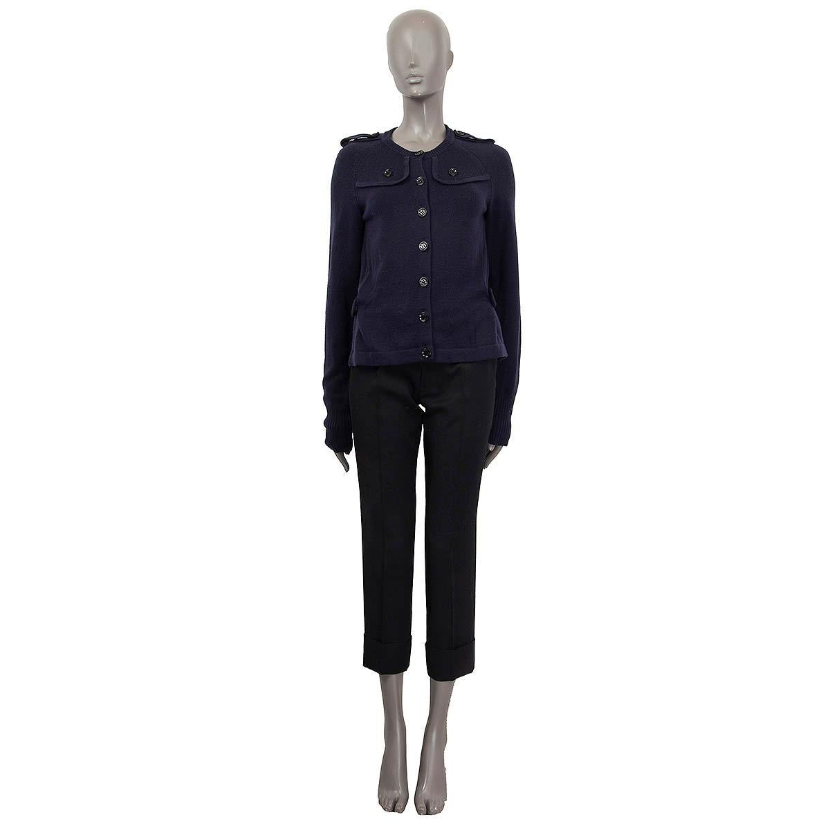 100% authentic Burberry London cardigan in navy blue wool (85%) and cashmere (15%). Features epaulettes on the shoulders, ruffles and a detachable belt on the back. Has long raglan sleeves (sleeve measurements taken from the neck). Opens with with