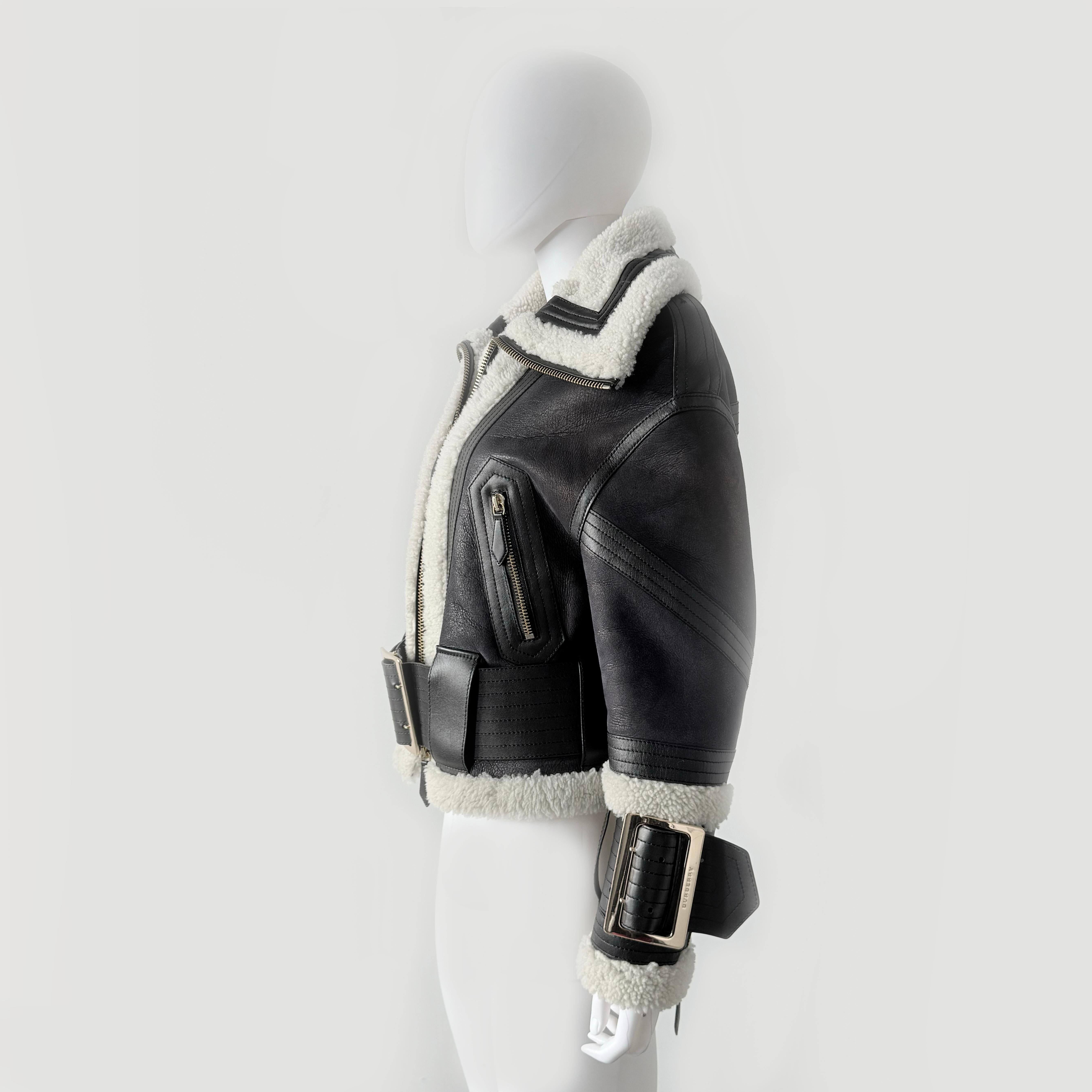 BURBERRY LONDON SHEARLING  MULTICOLOR  STYLE (BLACK BROWN BLUE) 

Leather belted with a big gold buckle and multiple pockets 
Material: Lamb Leather
Material interior: 100% Sheer/Mouton 
Style: Rider jacket
Color: Dark brown, black metallic look