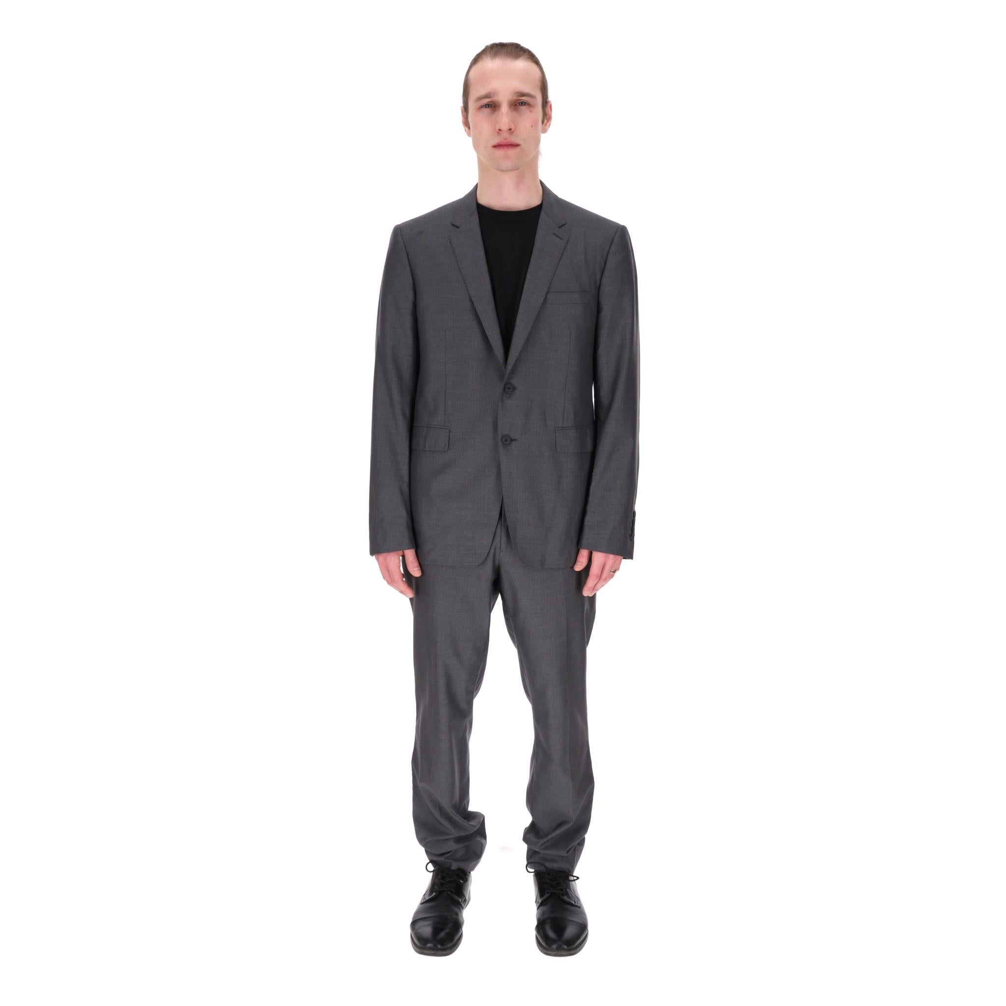 Burberry London Silk & Wool Blend Two-Piece Suit

Grey tailored two-piece suit crafted from silk and wool blend

Single-breasted jacket designed with flap pockets to the front and notched lapels.

'Burberry' embossed black buttons and slip pocket to