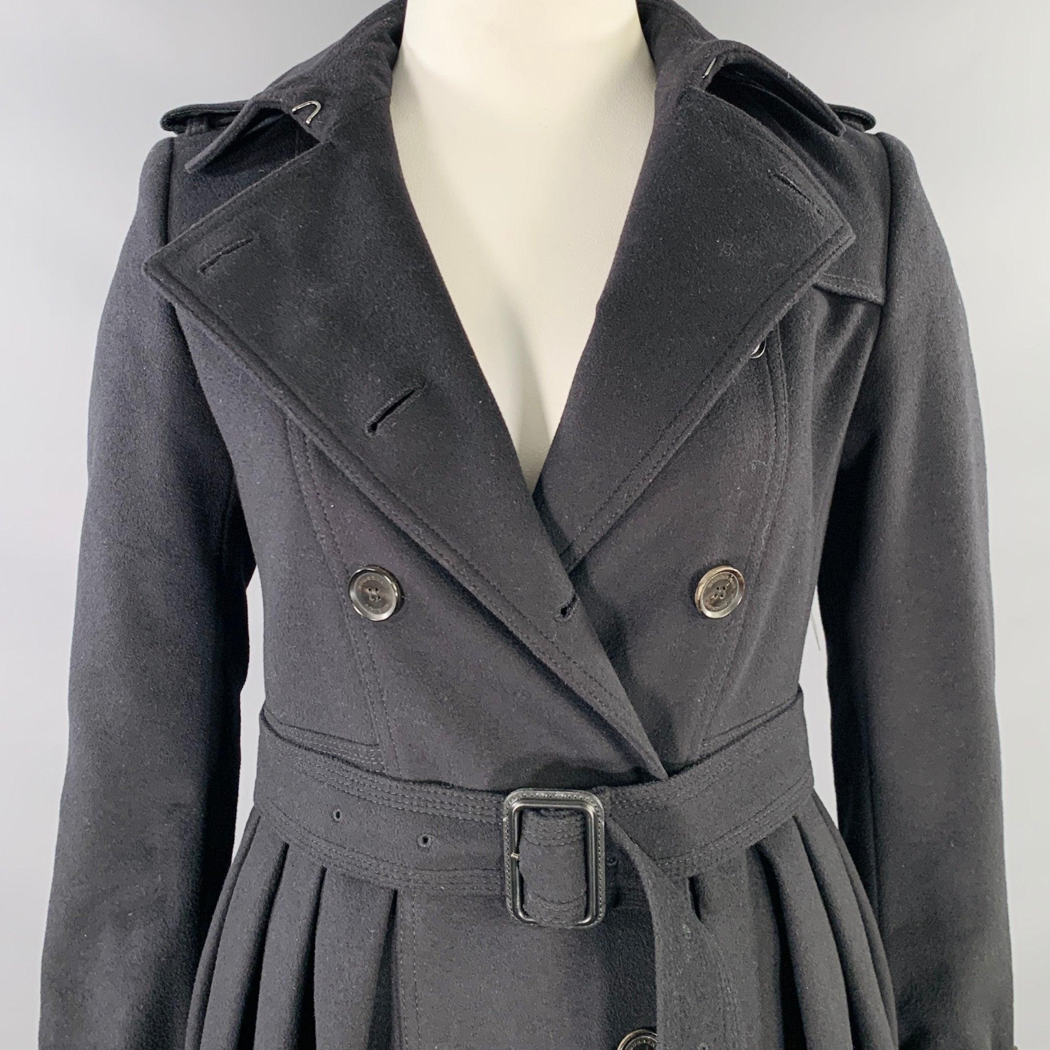 BURBERRY LONDON trench coat
in a black virgin wool cashmere blend featuring a double breasted style, A-line design, and button closure with belt.Excellent Pre-Owned Condition. 

Marked:   US 10 

Measurements: 
 
Shoulder: 15.5 inches Bust: 35
