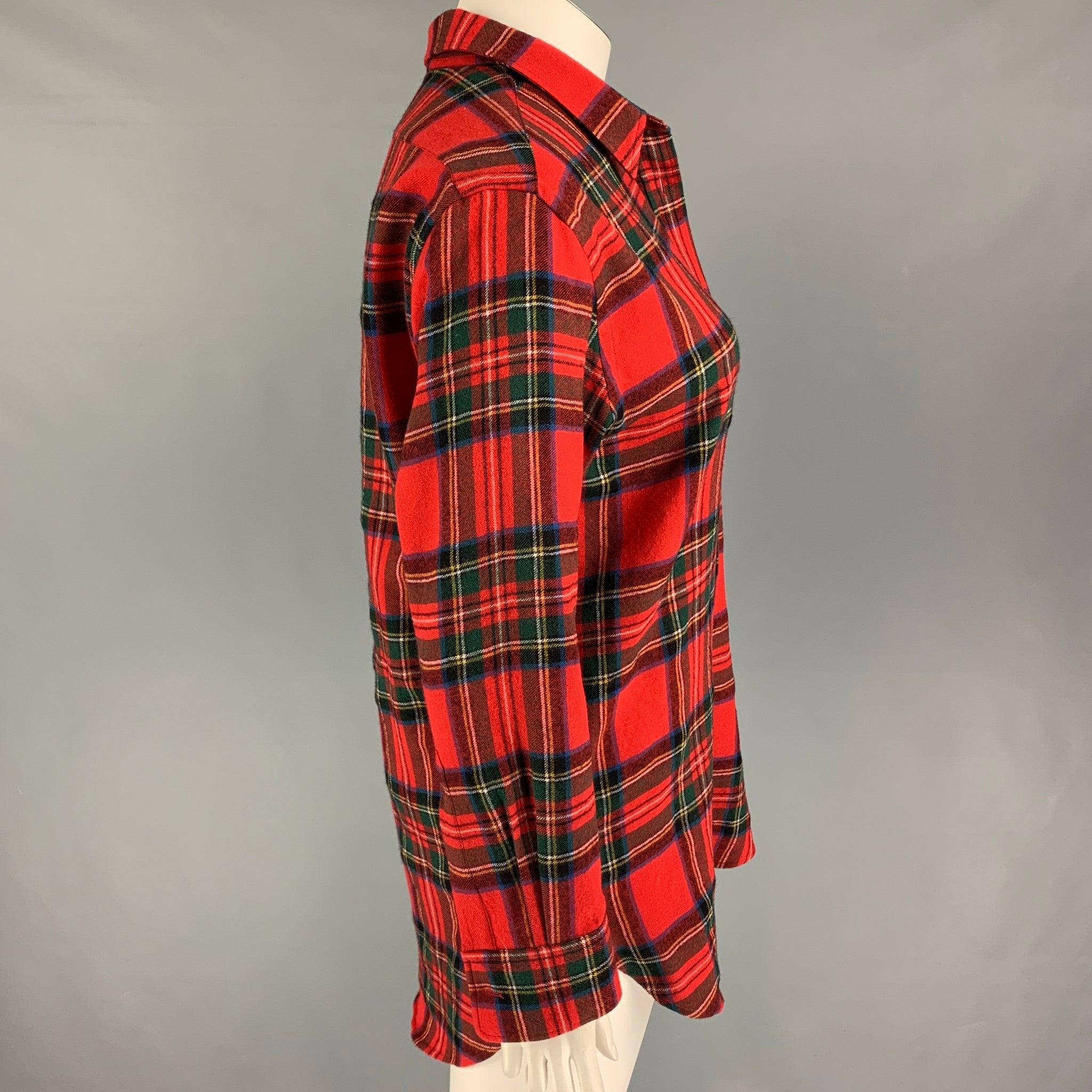 BURBERRY long sleeve shirt comes in a multi-color plaid wool featuring a spread collar, patch pocket, and a button up closure.
Very Good
Pre-Owned Condition. 

Marked:   UK 12 / US 10 / IT 44 

Measurements: 
 
Shoulder: 18 inches  Bust:
44 inches 