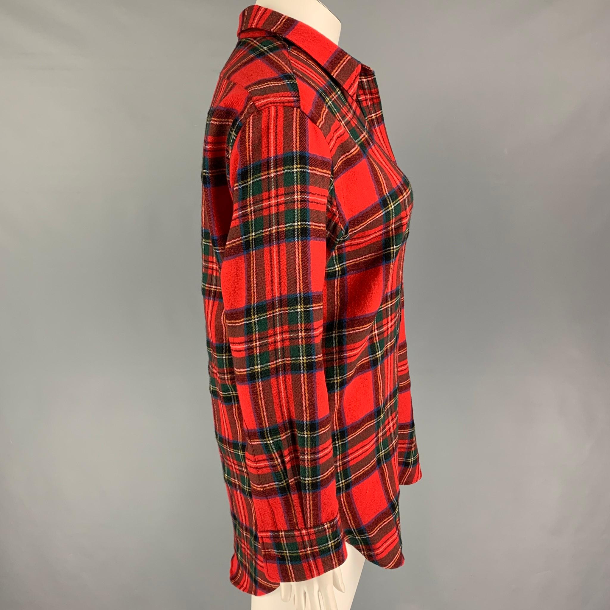BURBERRY long sleeve shirt comes in a multi-color plaid wool featuring a spread collar, patch pocket, and a button up closure. 

Very Good Pre-Owned Condition.
Marked: UK 12 / US 10 / IT 44

Measurements:

Shoulder: 18 in.
Bust: 44 in.
Sleeve: 23.5