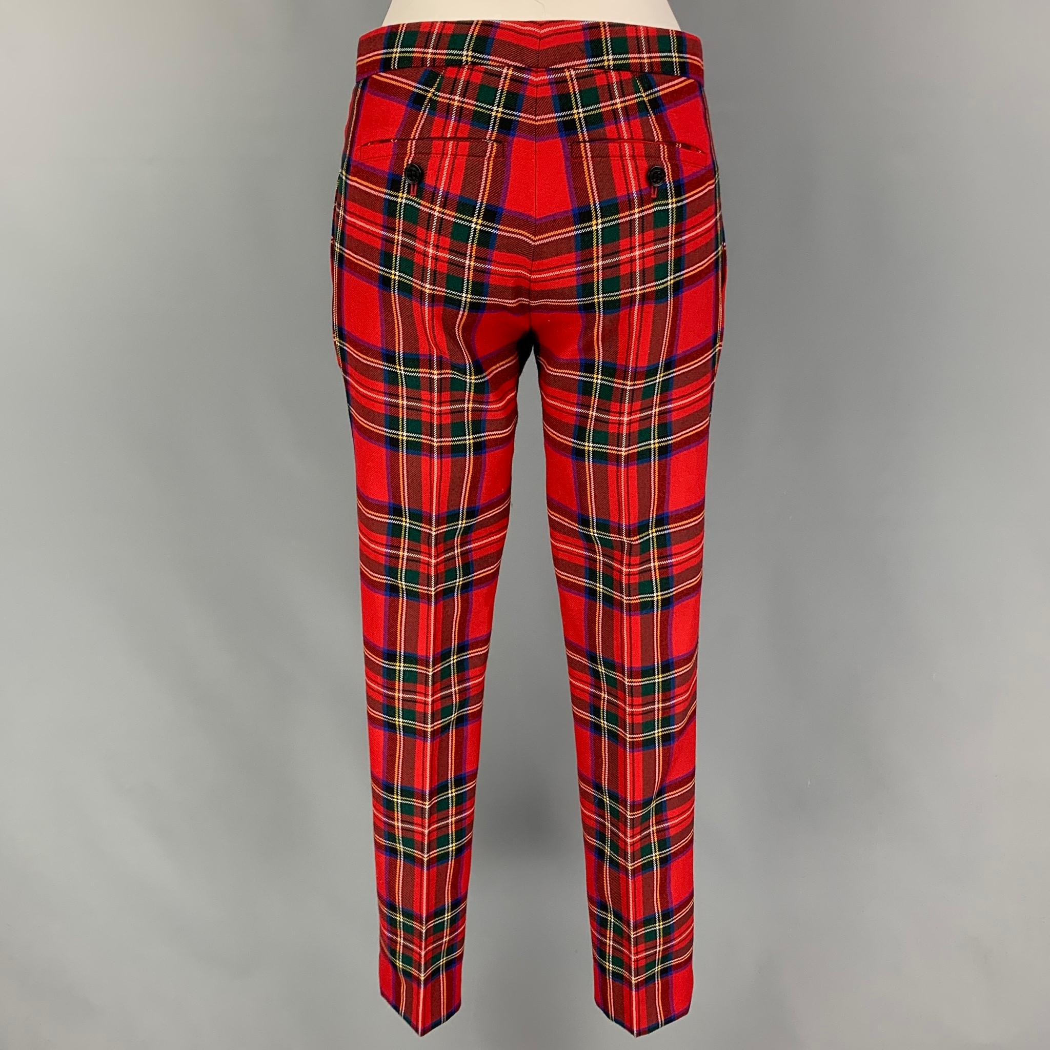 BURBERRY LONDON dress pants comes in a multi-color plaid wool featuring a slim fit, tapered, front tab, and a zip fly closure. 

Very Good Pre-Owned Condition.
Marked: UK 4 / US 2 / IT 36

Measurements:

Waist: 30 in.
Rise: 8.5 in.
Inseam: 30 in. 