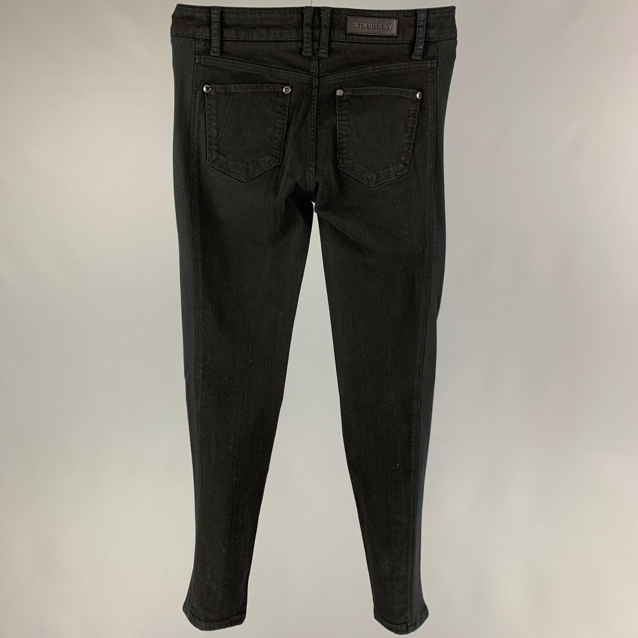 BURBERRY LONDON jeans comes in a black material featuring a skinny fit and a zip fly closure.
Very Good
Pre-Owned Condition. 

Marked:   29 

Measurements: 
  Waist: 29 inches  Rise: 9 inches  Inseam: 29 inches 
  
  
 
Reference: 119336
Category: