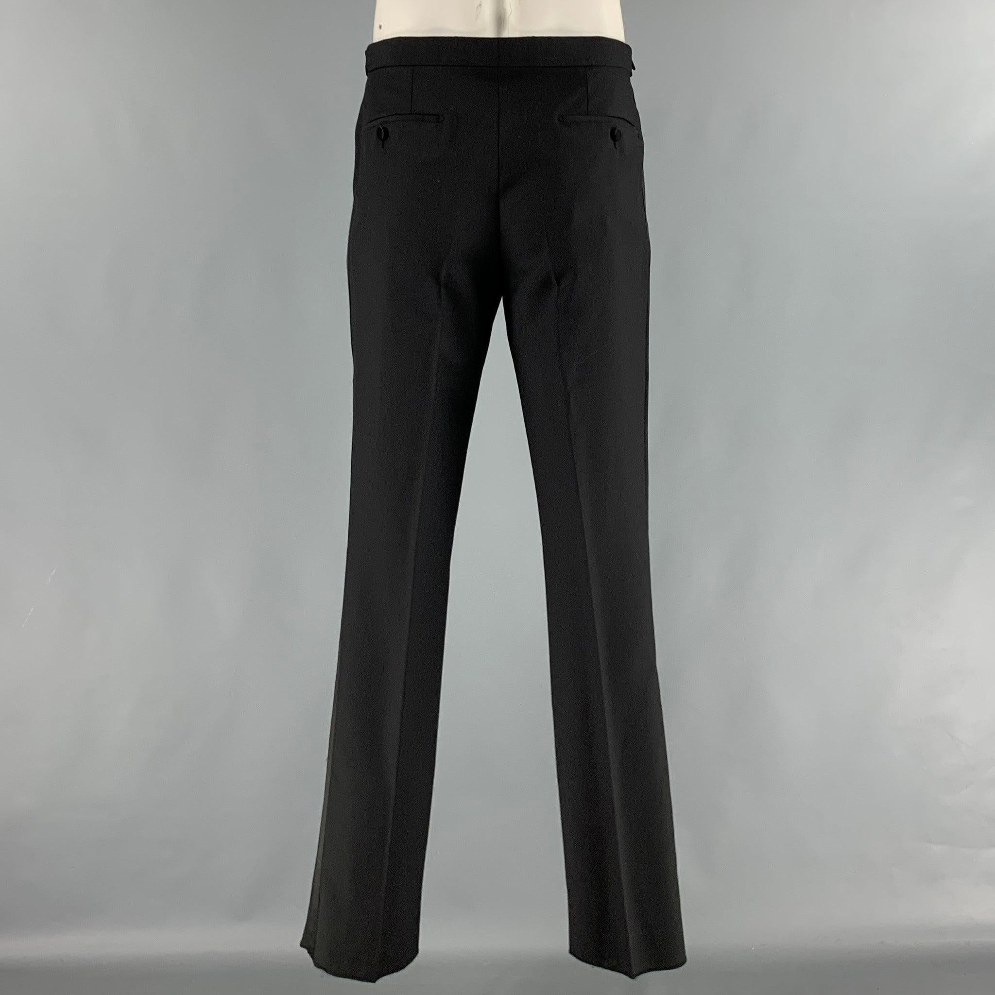 BURBERRY LONDON tuxedo dress pants comes in a black cupro woven material featuring a flat front, side tabs, and a button fly closure. Made in Italy. Excellent Pre-Owned Condition. 

Marked:   52R 

Measurements: 
  Waist: 34 inches Rise: 9 inches