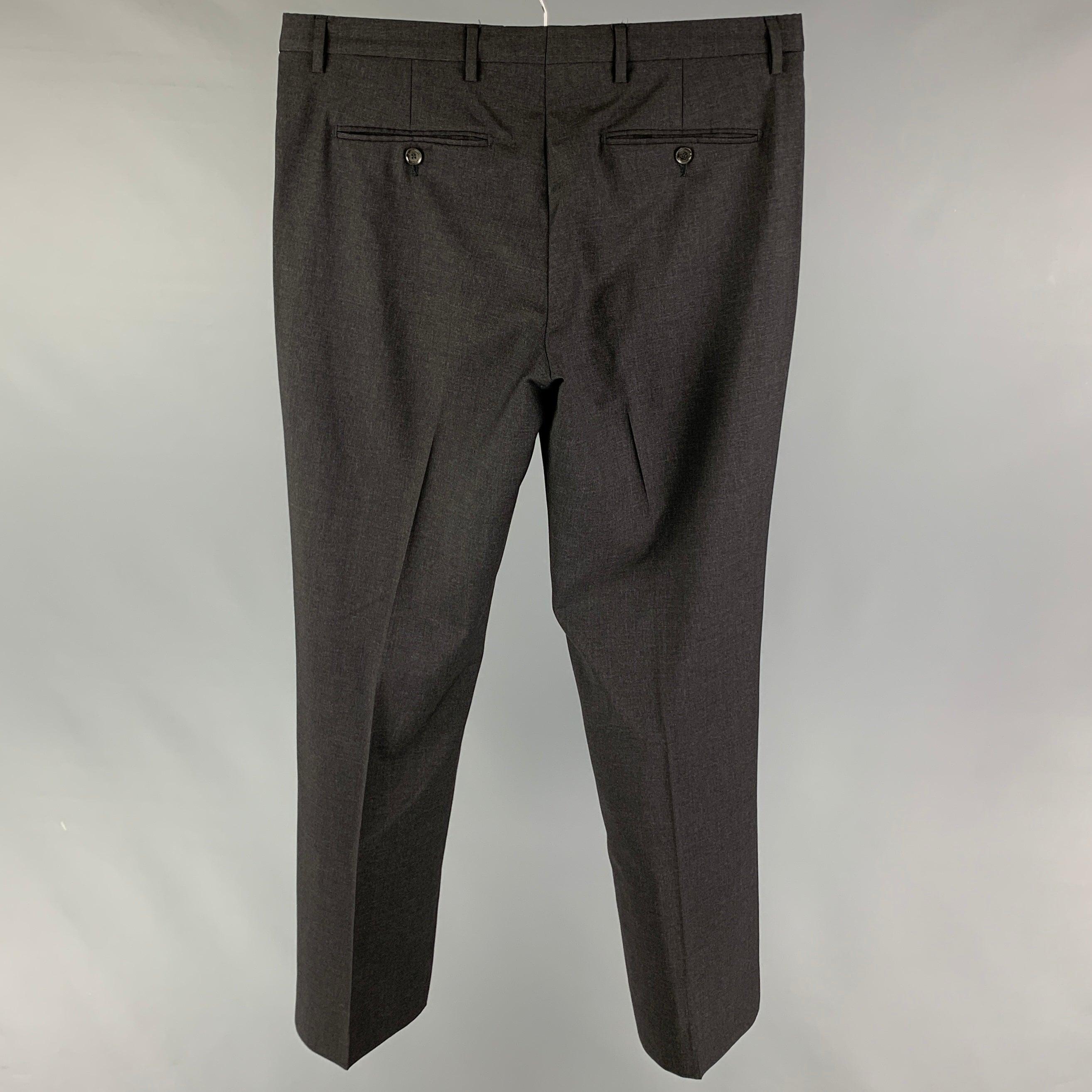 BURBERRY LONDON dress pants comes in a charcoal virgin wool featuring a flat front, front tab, and a zip fly closure. Made in Portugal.
Very Good
Pre-Owned Condition. 

Marked:   50-34 

Measurements: 
  Waist: 34 inches  Rise: 9.5 inches  Inseam: