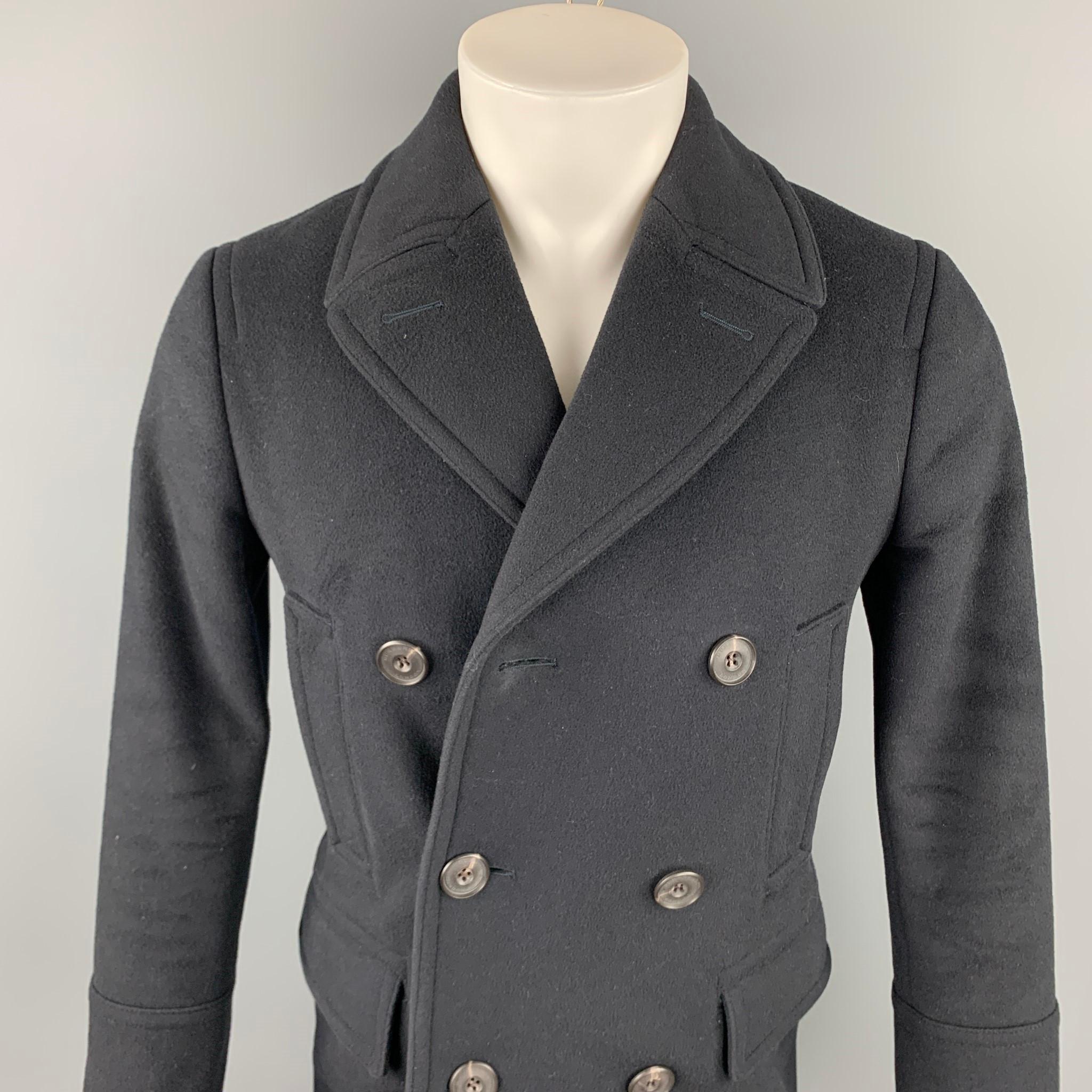 BURBERRY LONDON peacoat comes in a black wool with a full liner featuring front pockets, back buttoned, and a double breasted closure. 

Good Pre-Owned Condition.
Marked: No size tag
Original Retail Price: $1,595.00

Measurements:

Shoulder: 17