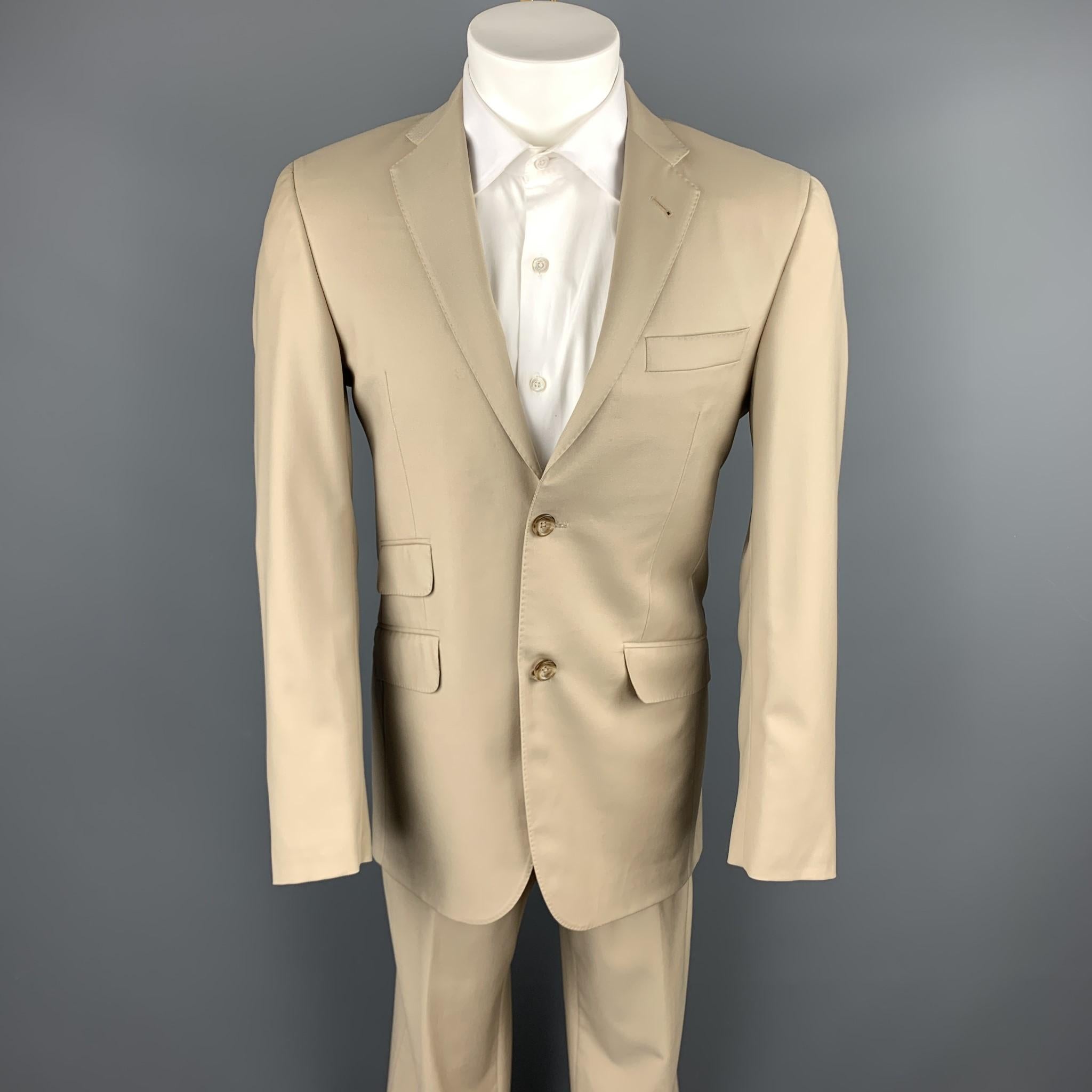 BURBERRY LONDON suit comes in a khaki wool and includes a single breasted, two button sport coat with a notch lapel and matching flat front trousers. Made in USA.

Excellent Pre-Owned Condition.
Marked: 36

Measurements:

-Jacket
Shoulder: 16