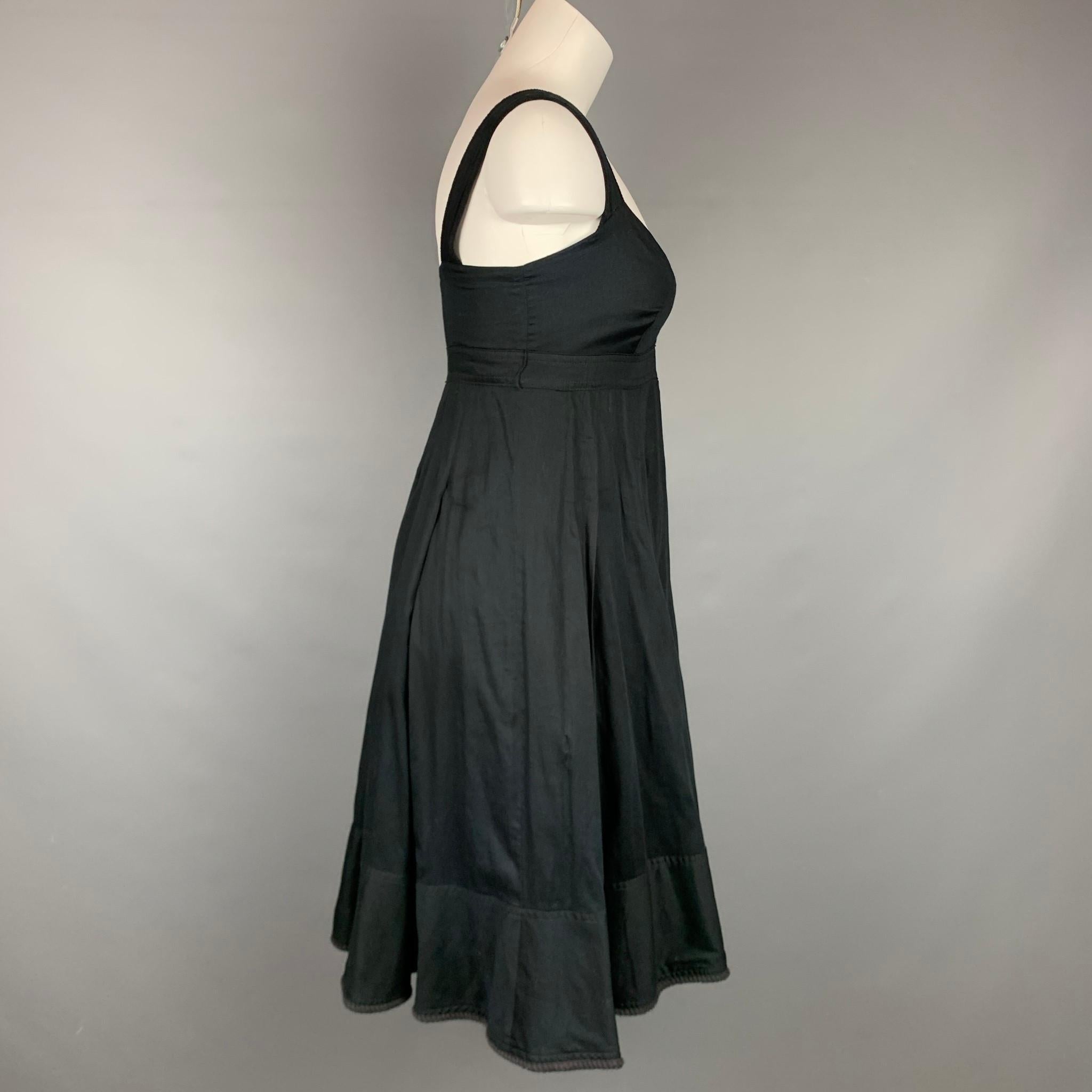 BURBERRY LONDON dress comes in a black pleated cotton featuring a twisted trim, a-line style, and a side zipper closure. Made in Italy.

Very Good Pre-Owned Condition.
Marked: US 4 / UK 6
Original Retail Price: $850.00

Measurements:

Bust: 32