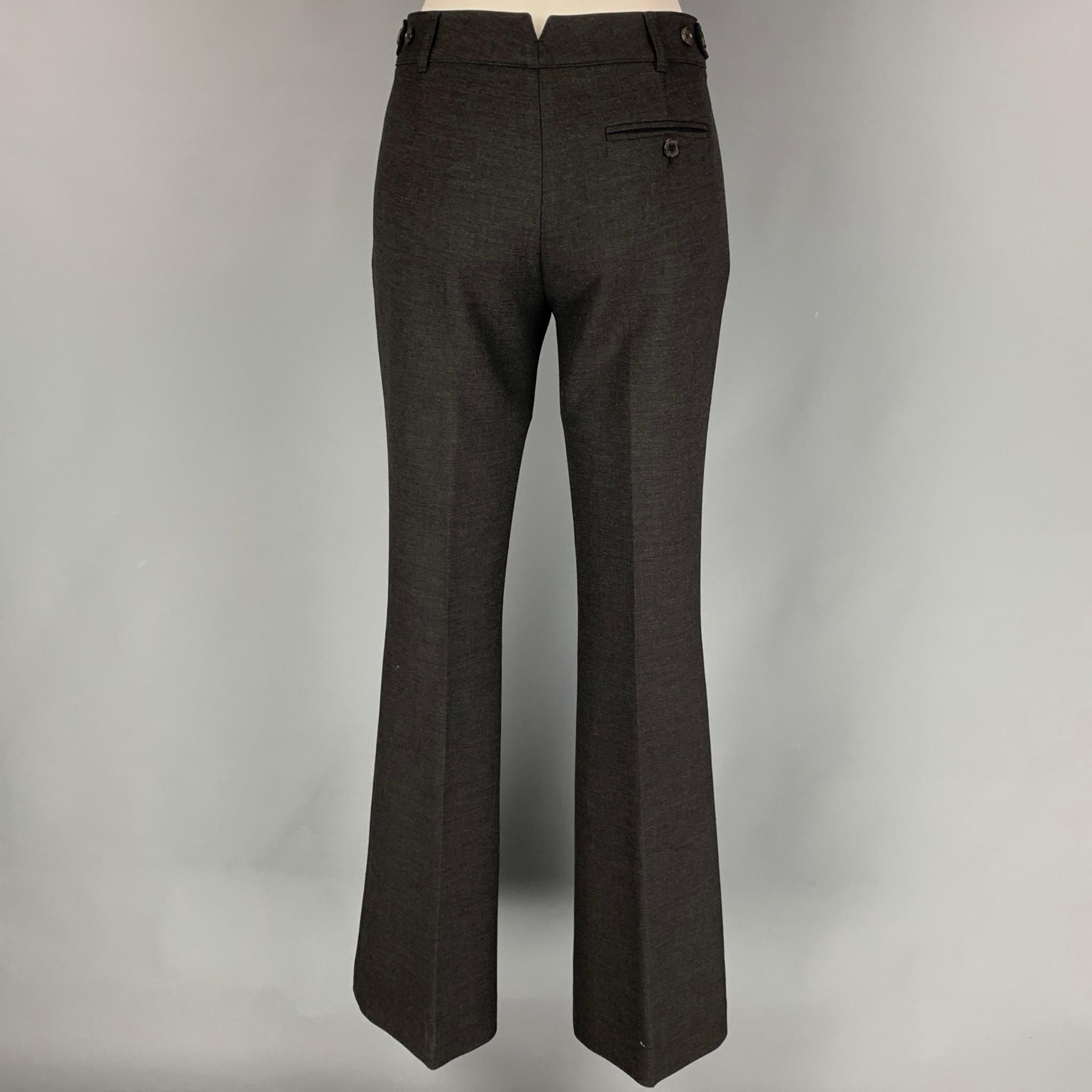 BURBERRY LONDON dress pants comes in a charcoal polyester blend featuring a wide leg style, side tabs, and a zip fly closure. Made in Portugal.

Very Good Pre-Owned Condition.
Marked: UK 6 / USA 4 / ITA 38 / GER 34

Measurements:

Waist: 30