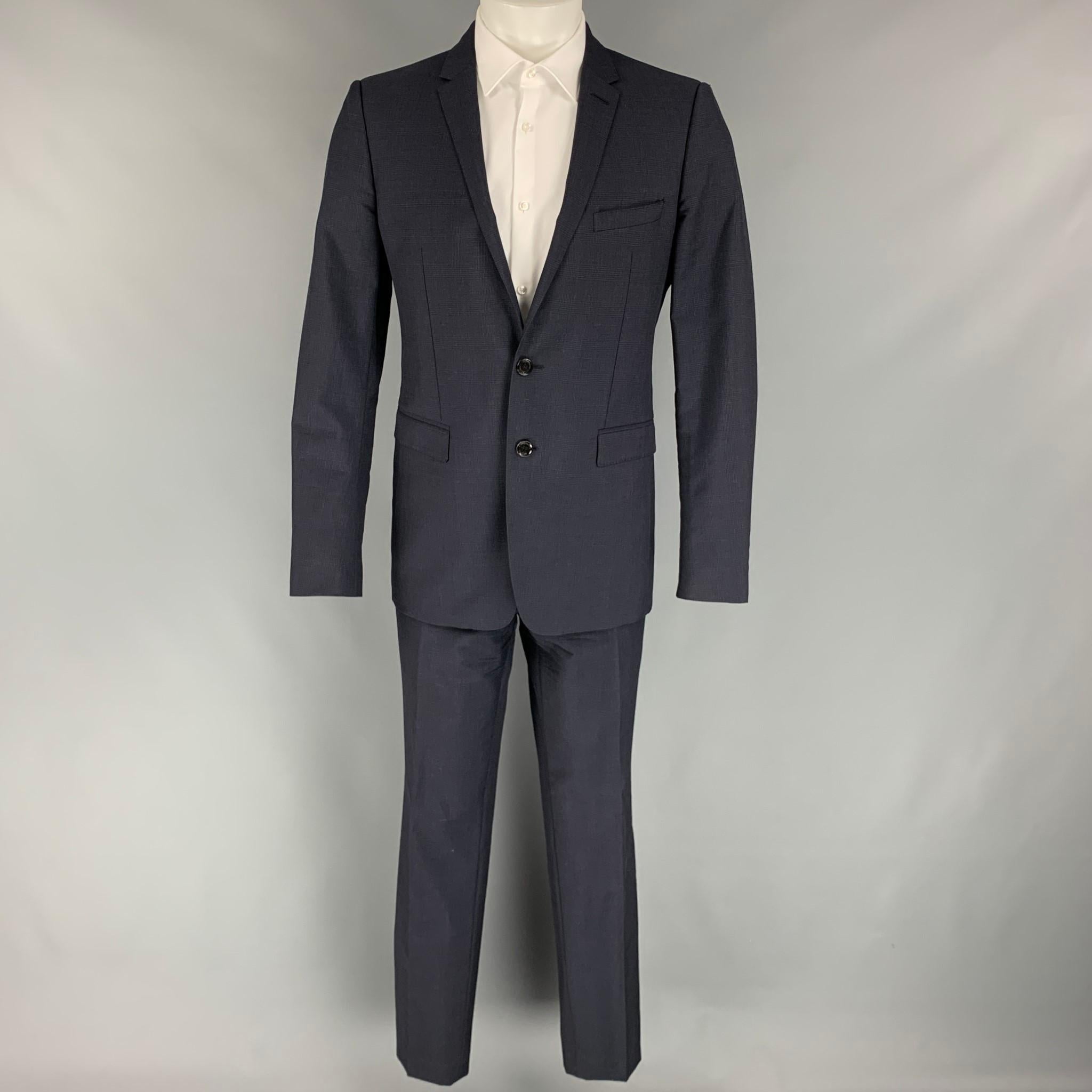 BURBERRY LONDON suit comes in a navy glenplaid wool / mohair with a full liner and includes a single breasted, double button sport coat with a notch lapel and matching flat front trousers. Made in Italy.

Very Good Pre-Owned Condition.
Marked: