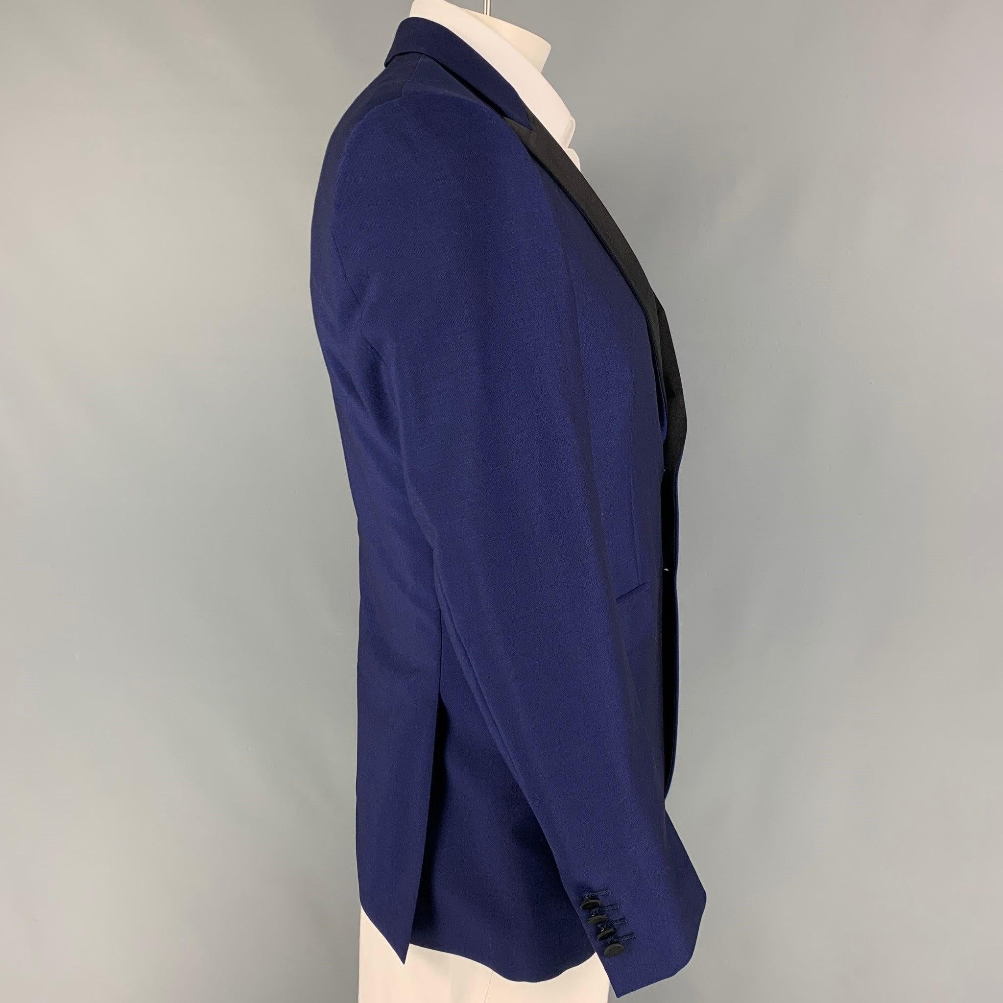 BURBERRY LONDON sport coat comes in a royal blue & black wool with a full liner featuring a peak lapel, flap pockets, double back vent, and a double button closure. Made in Italy.
Excellent
Pre-Owned Condition. 

Marked:   50 R  

Measurements: 

