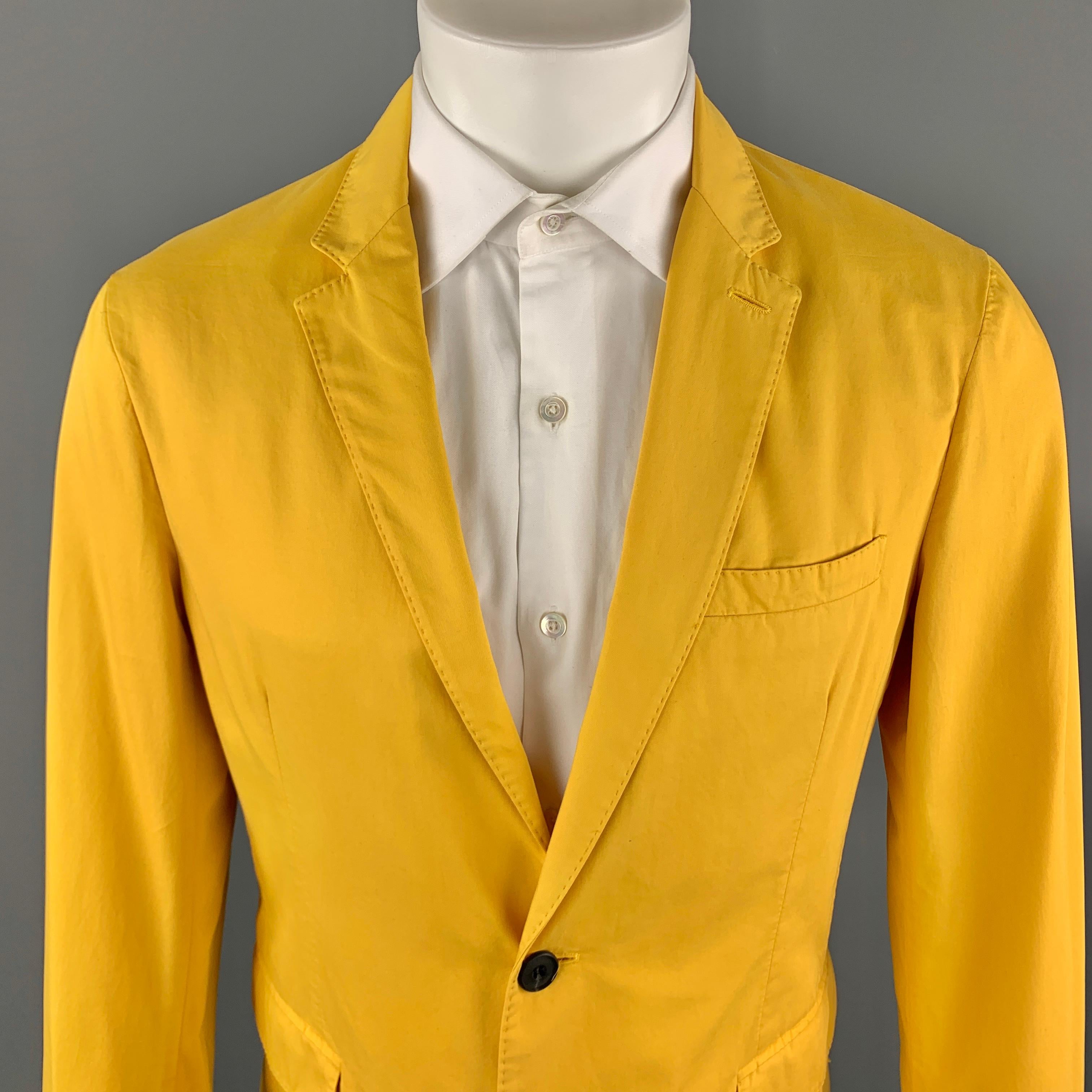 BURBERRY LONDON Sport Coat comes in a yellow solid cotton material, with a notch lapel, two buttons at closure, single breasted, slit and flap pockets, functional buttons at cuffs, a single vent at back, unlined. Made in Italy. 

Excellent Pre-Owned