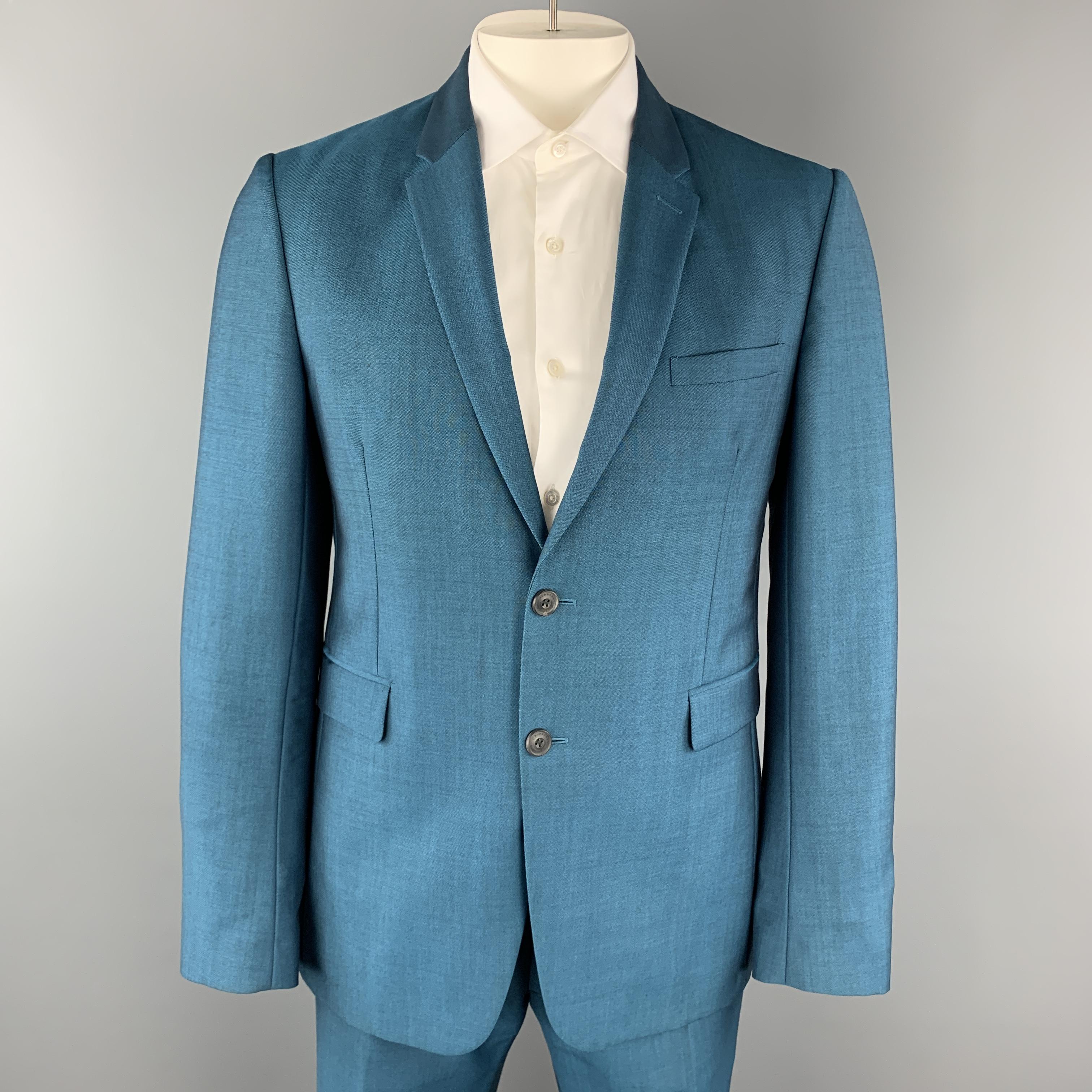 BURBERRY LONDON suit comes in a bold teal blue wool mohair blend sharkskin and includes a single breasted, two button sport coat with a notch lapel and matching flat front trousers. Spot on blazer. As-is. Made in Portugal.

Excellent Pre-Owned