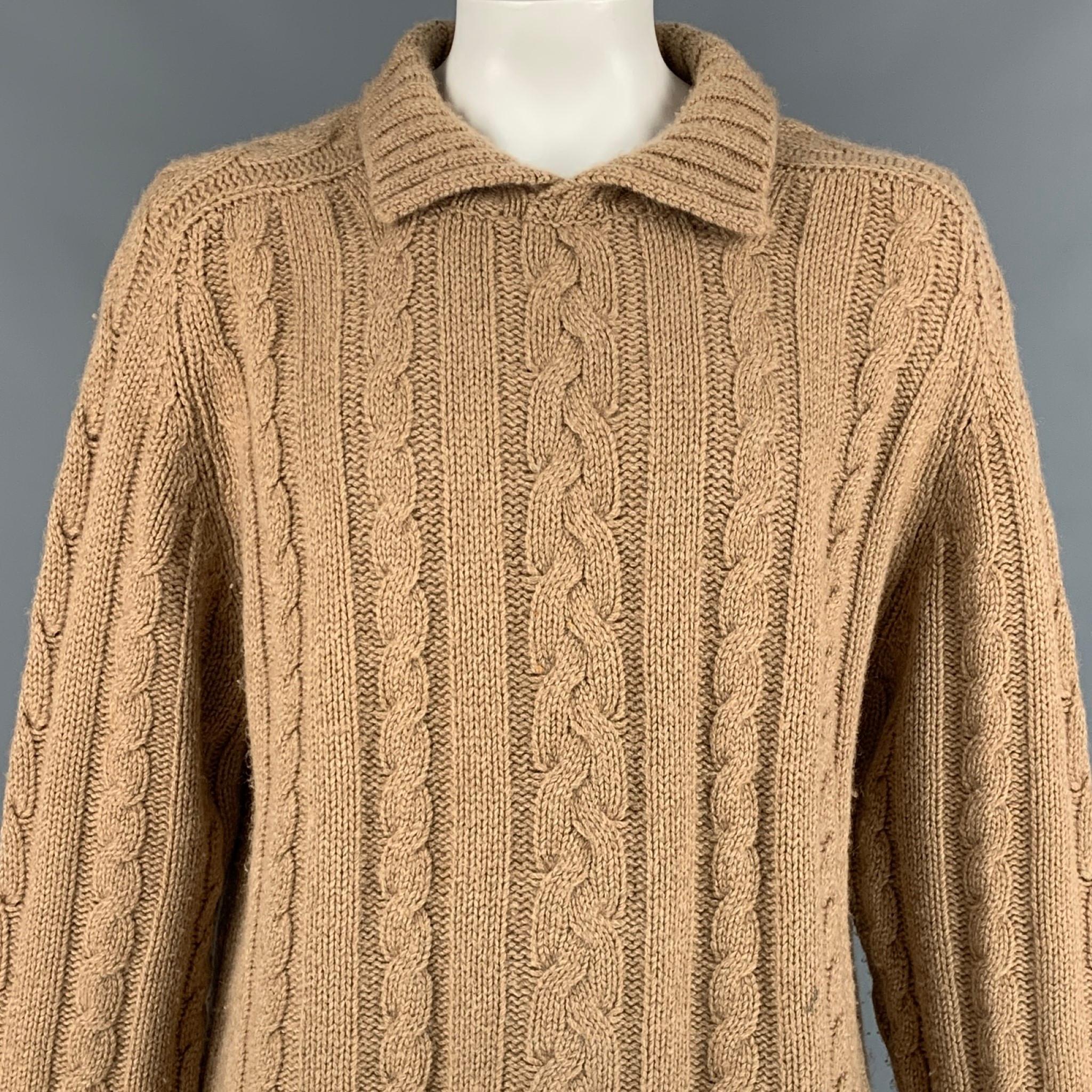 BURBERRY LONDON sweater comes in a camel cable knit camel hair featuring a loose fit and a spread collar. Made in England. 

Very Good Pre-Owned Condition. Light marks at front.
Marked: XL

Measurements:

Shoulder: 18 in.
Chest: 52 in.
Sleeve: 32