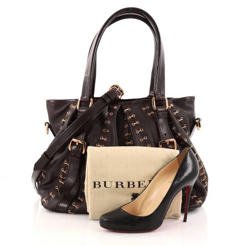 This authentic Burberry Lowry Convertible Tote Chain Stitched Leather Large is luxurious and sophisticated design perfect for all seasons. Crafted from brown leather, this tote features gold-tone metal stitches, dual tall flat top handles with
