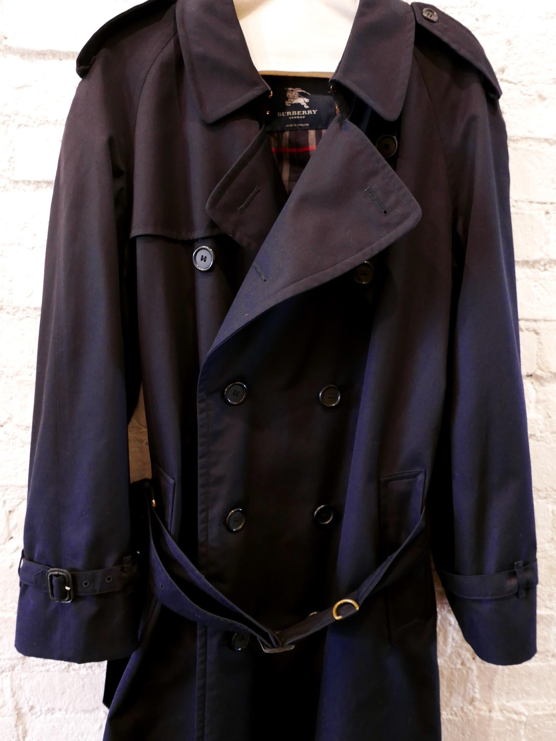 2006 Burberry Men's Navy 3/4 Length Trench Coat. Bought it London in 2006. Slightly too big and kept unworn in the closet ever since. 

Material: Polyester Cotton
Color: Navy
Origin: United Kingdom  
Size: 48R (UK)
Actual Measurements:
- chest