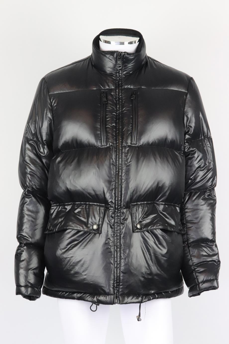 Burberry men's quilted shell down jacket. Black. Long sleeve, mock neck. Zip fastening at front. 100% Nylon; lining: 100% cotton; sleeve lining: 100% acetate; filling: 75% duck down, 25% feather. Size: Large (IT 50, EU 50, UK/US Chest 50). Shoulder