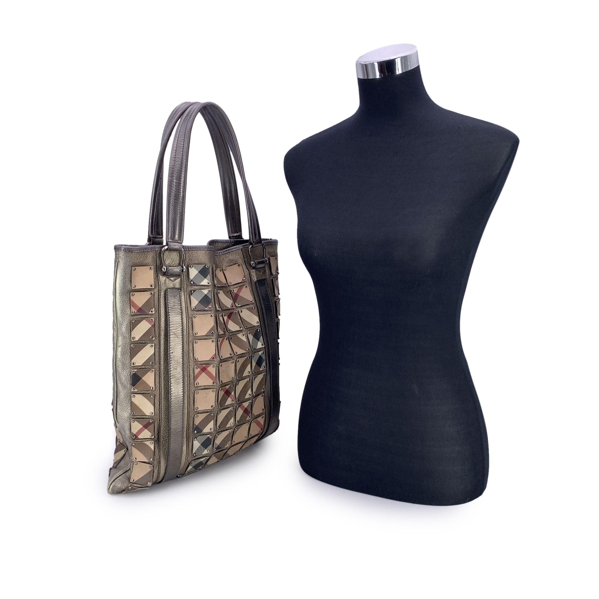 This beautiful Bag will come with a Certificate of Authenticity. The certificate will be provided at no further cost For lovers of iconic heritage with a bold twist, this Burberry Brooke Warrior Tote Bag is a standout piece that blends classic