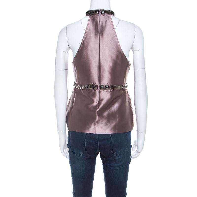 A top like this one will come in handy especially with tailored trousers and skirts. This metallic purple piece from Burberry has a halter neckline, zip closure and trims of stud embellishments.

