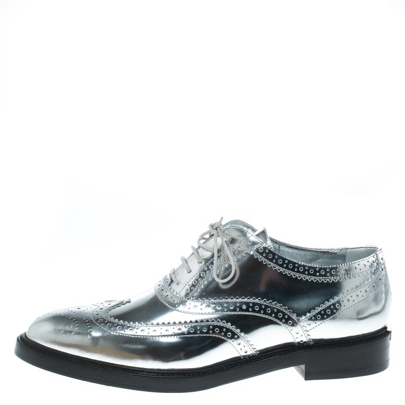 Oxfords are a staple style in every fashionista's wardrobe. This pair from Burberry has been crafted in Italy with beautiful brogue leather in metallic silver and fastened with laces. Stylish and comfortable, this pair is a must-have.

Includes: