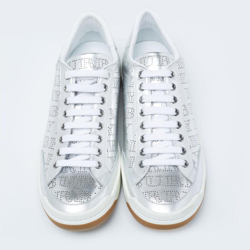 These leather sneakers are ideal for lending a dramatic twist to your outfits. Crafted from silver leather with perforated details, this stylish pair by Burberry is a mark of luxury. They feature the brand's logo throughout and have a lace-up front,