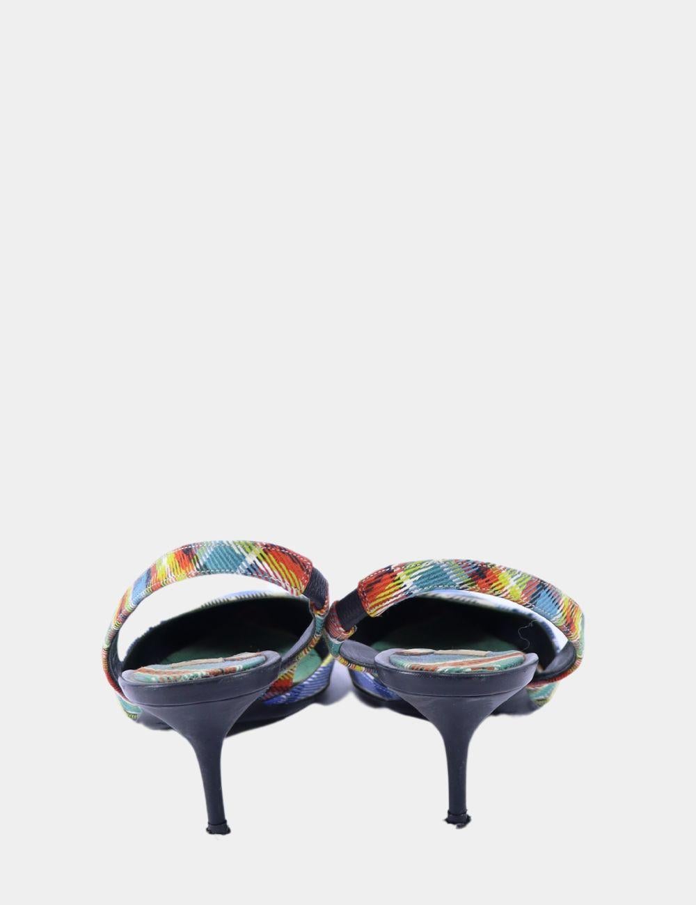 Step out in standout style with these Burberry Multicolor Tartan Slingback Pumps. Featuring a bold, playful take on the brand’s iconic check, these pointed toe heels are crafted from a vibrant multicolor tartan fabric with an elegant slingback