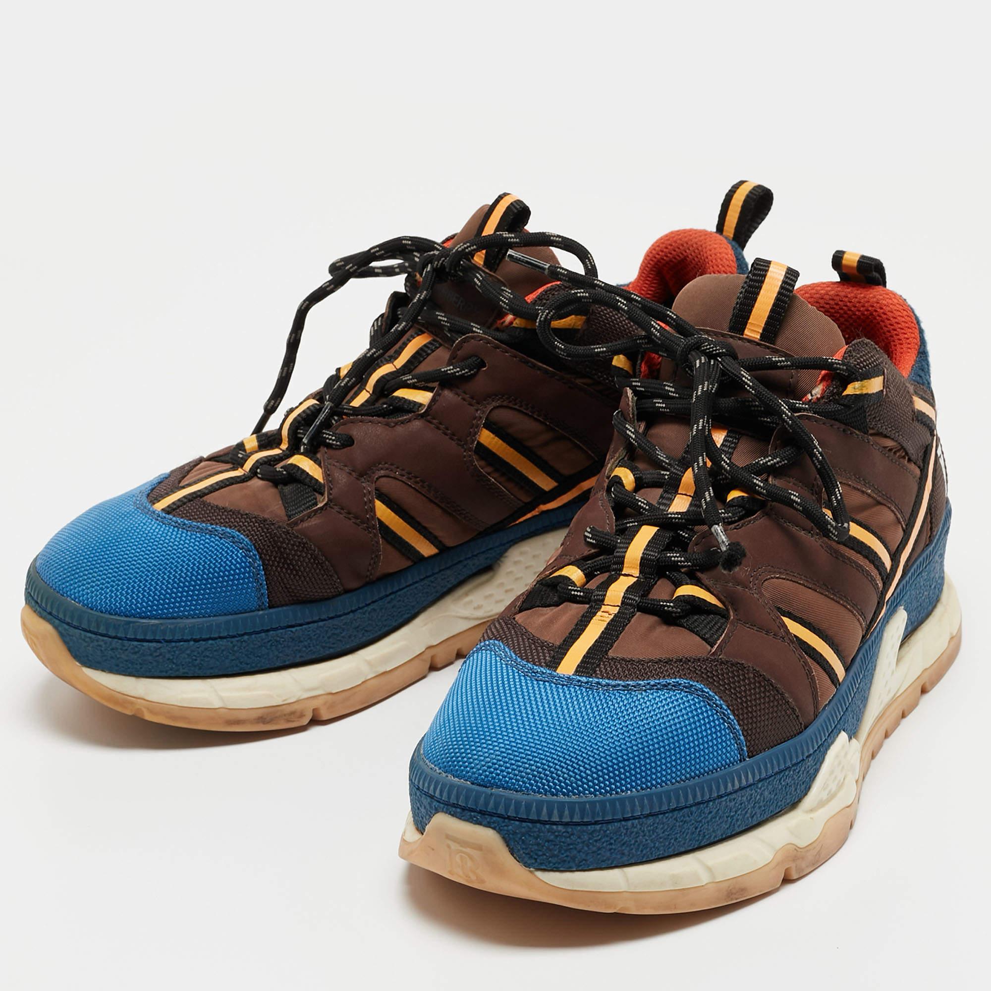 Now look fashionable even in your casuals! Beautifull crafted from canvas, these sneakers flaunt a color block design with a lace-up vamp, elevated midsoles and the label on the counters. Grab this Burberry creation today and team them up with your