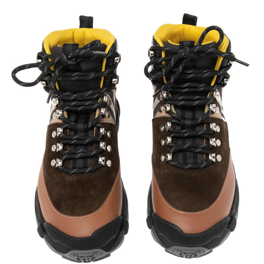 Burberry’s multicolor canvas and leather hiking boots are set on tough tread soles, echoing the label's modern and sophisticated aesthetic. They’re made in Italy with padded tongues hallmarked with the house's name, lace fastenings, and round