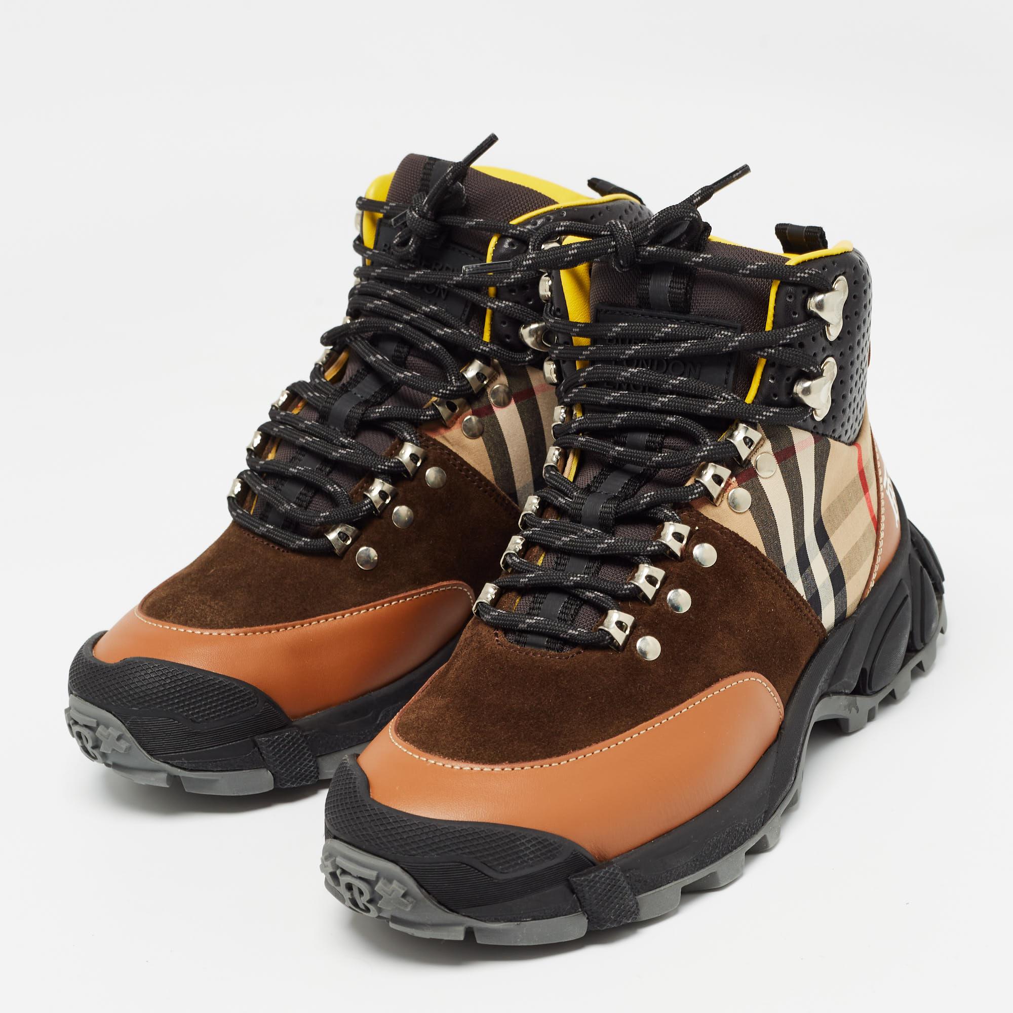 Burberrys multicolored hiking boots are set on tough tread soles, echoing the label's modern and sophisticated aesthetic. They are made in Italy with padded tongues hallmarked with the house's name, lace fastenings, and round toes.
