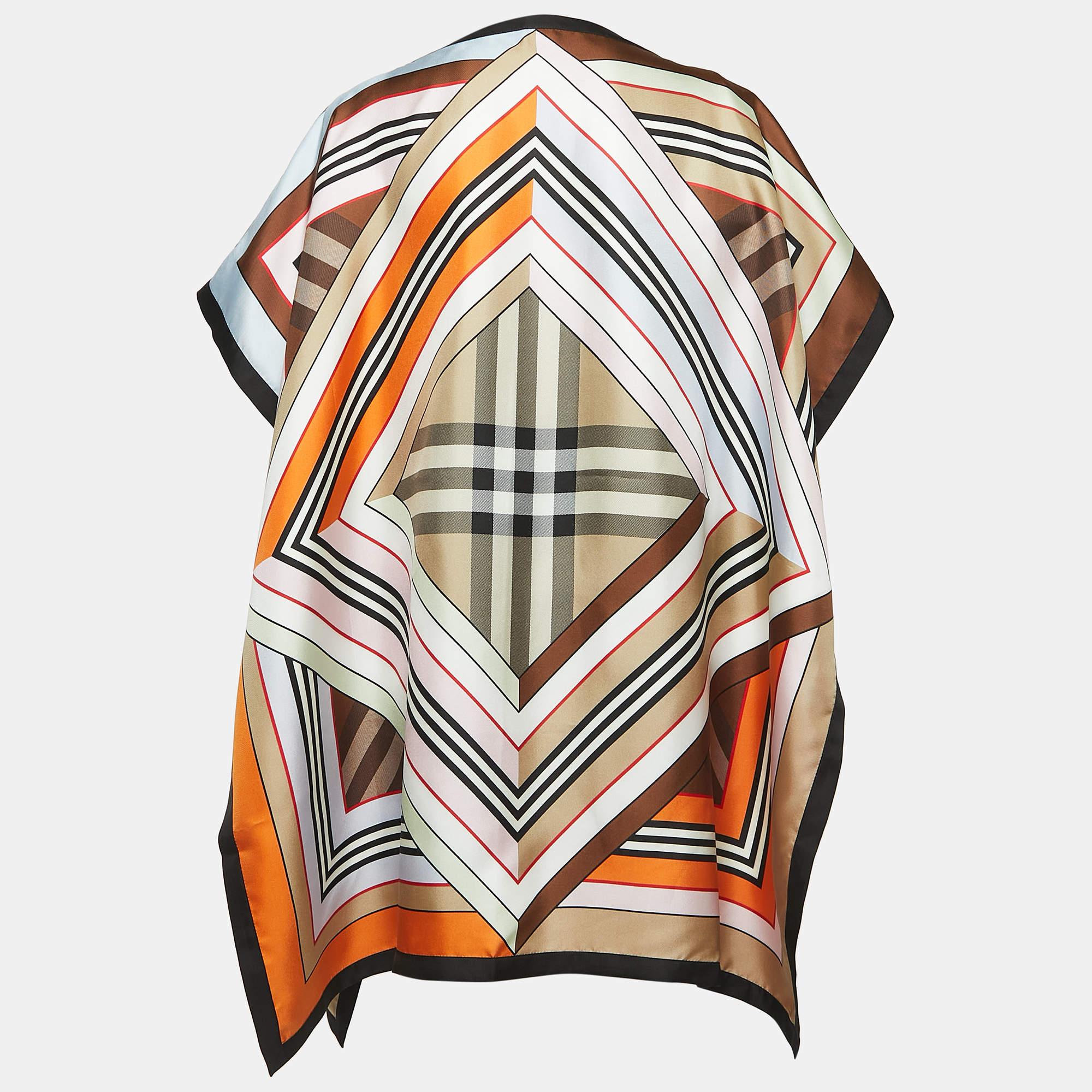 The Burberry cape coat is a luxurious fashion piece, crafted from sumptuous silk. It features a captivating montage print in a variety of vibrant colors, a cape-style design, and a loose, flowing silhouette. This coat is a statement of artistry and