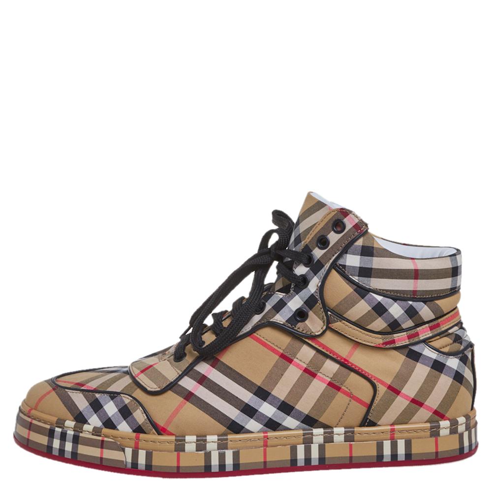 Burberry's refined aesthetics come alive in these high-top sneakers. Crafted from vintage check fabric in multiple hues, they feature round toes, laces on the vamps, and padded cuffs for maximum comfort. Style them with basic jeans and polo t-shirts