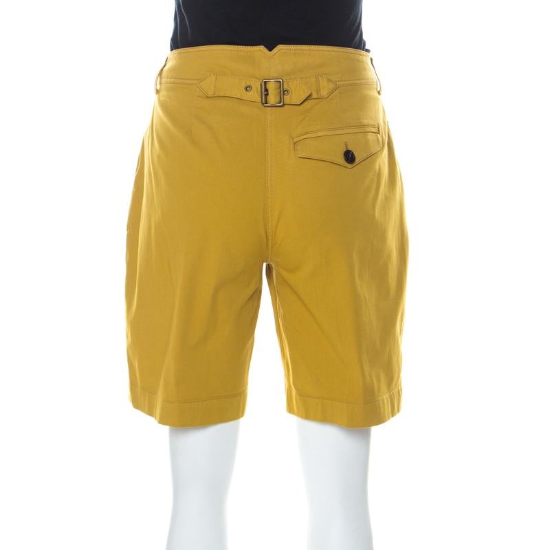 Designed for the young, modern women, these Burberry shorts are cut from a cotton blend. It features a yellow hue and is adorned with bow detail at the back waistline. Wear this with a tee and flats for a casual yet chic look.

Includes: The Luxury