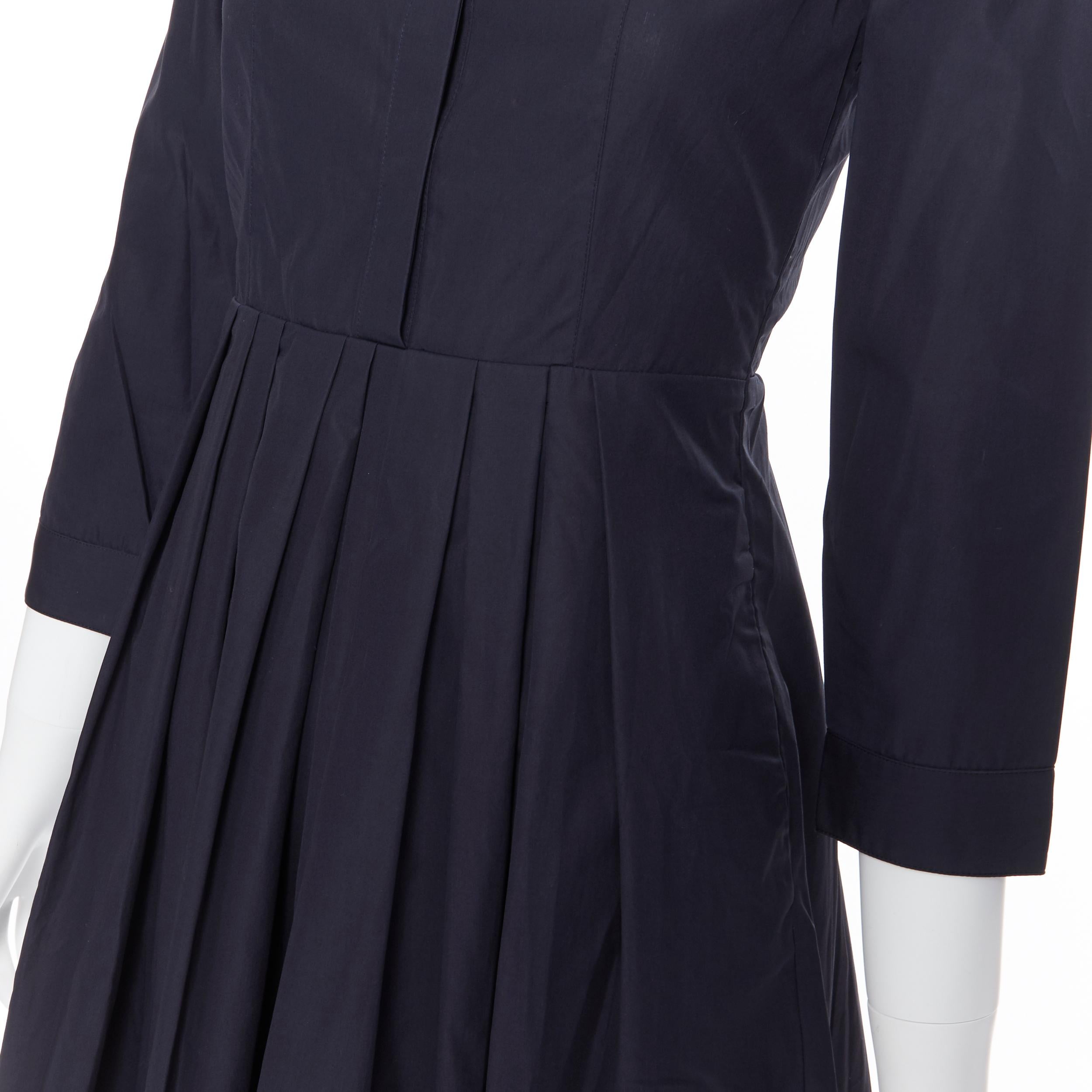BURBERRY navy blue cotton pleated skirt safari detail casual dress IT36 XS
Brand: Burberry
Model Name / Style: Cotton dress
Material: Cotton
Color: Navy
Pattern: Solid
Closure: Button
Extra Detail: Military inspired shoulder epaulette design.