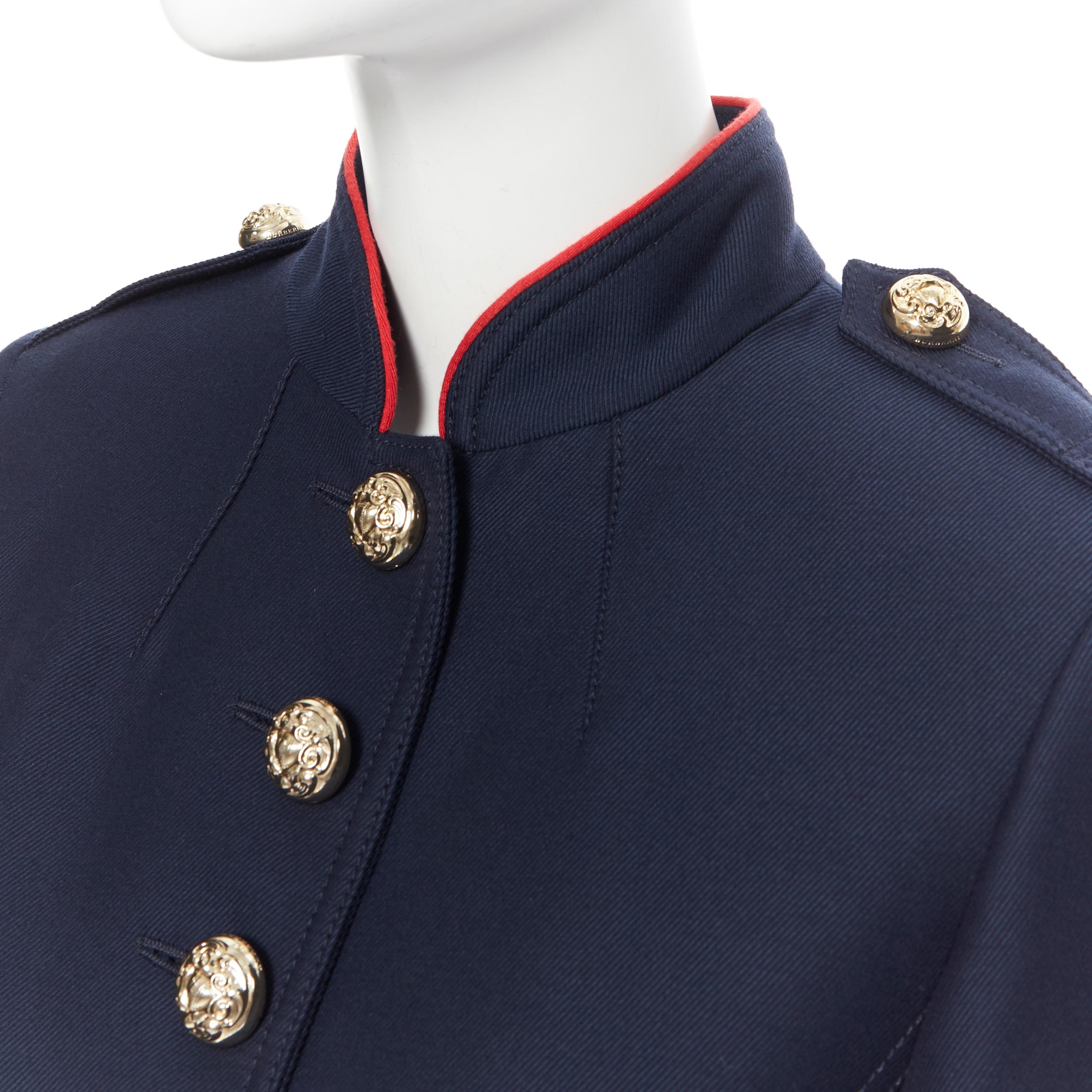 BURBERRY navy wool cotton gold button officer collar military jacket UK6 XS
Brand: Burberry
Designer: Christopher Bailey
Model Name / Style: Military jacket
Material: Wool, cotton blend
Color: Navy
Pattern: Solid
Closure: Button
Lining material: