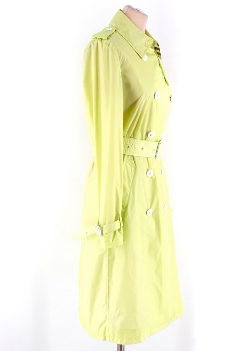 Burberry Neon Green Trench Coat

-Neon green trench rain coat
-White embossed button closure
-Features belt with buckle
-Mesh lining

Please note, these items are pre-owned and may show signs of being stored even when unworn and unused. This is