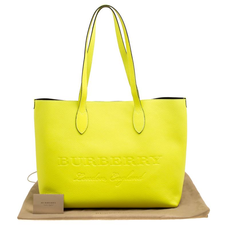 When you carry this Burberry creation, be ready to catch admiring glances as this Remington tote is stylish and functional. The bag has been crafted from leather in a gorgeous neon yellow shade. It is equipped with two handles, and a very spacious