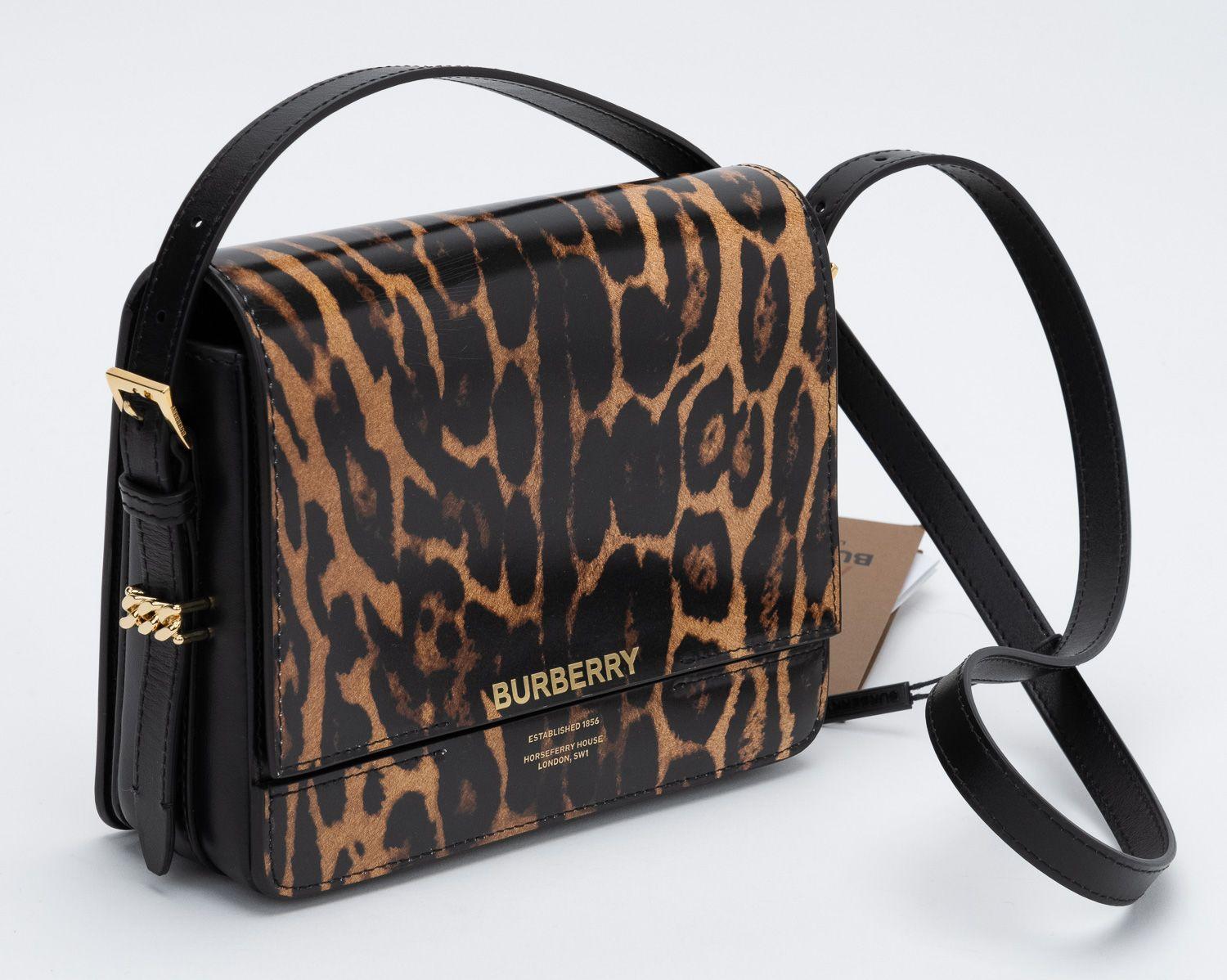 Burberry New Calfskin black and cheetah print shoulder bag.
Shoulder drop 18