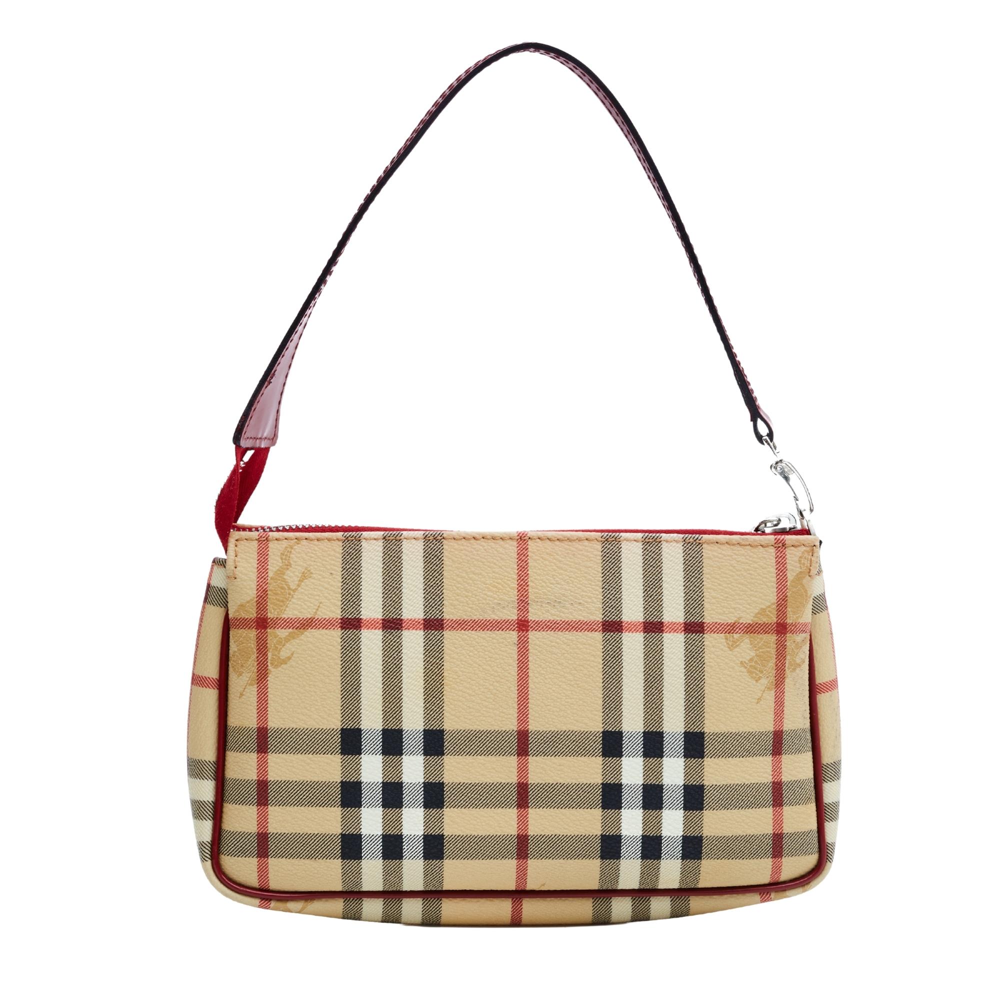 This mini bag is made with beige coated canvas with Burberry's signature nova check patten print throughout. The bag features red leather trim, a flat red leather strap for shoulder carry, top zip closure and black woven fabric interior lining.