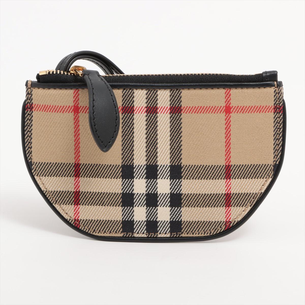 The Burberry Nova Check Coin Purse in Beige combines classic elegance with practical functionality. Crafted from Burberry's iconic Nova Check canvas, the coin purse features the brand's distinctive beige check pattern, offering a timeless aesthetic.